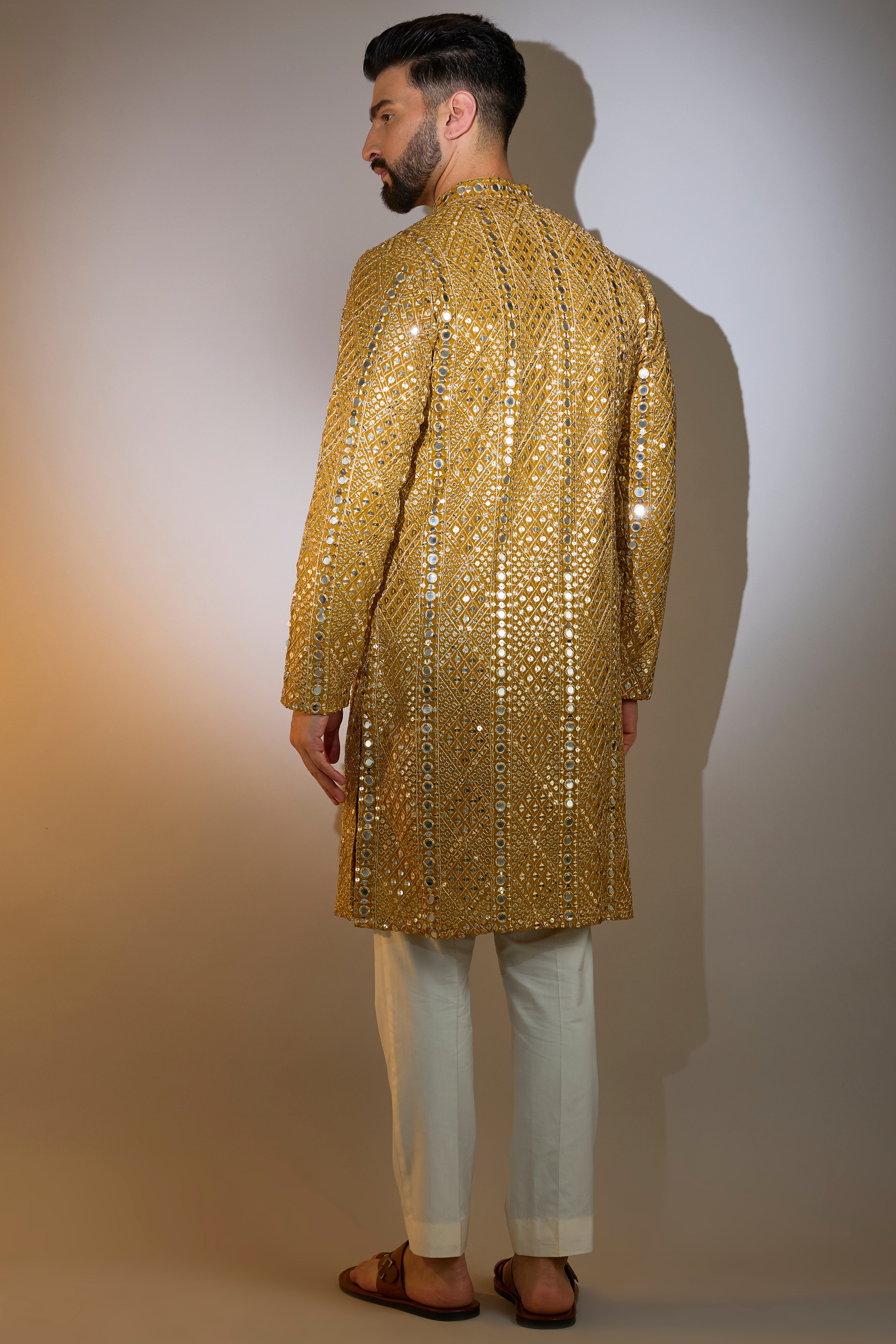 mustard mirror work kurta with intricate zari work