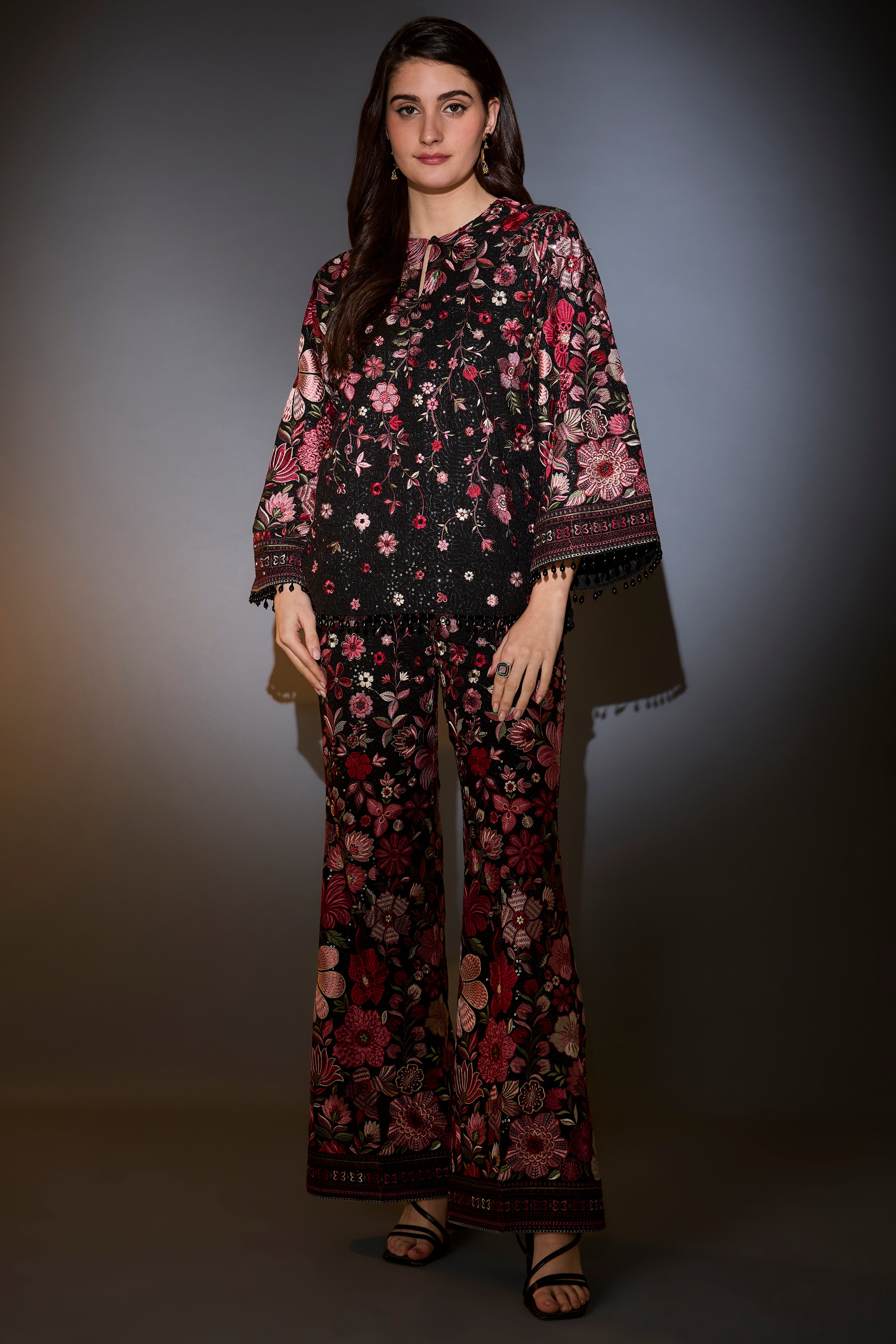 Multi-coloured floral tunic set with boot cut trousers.