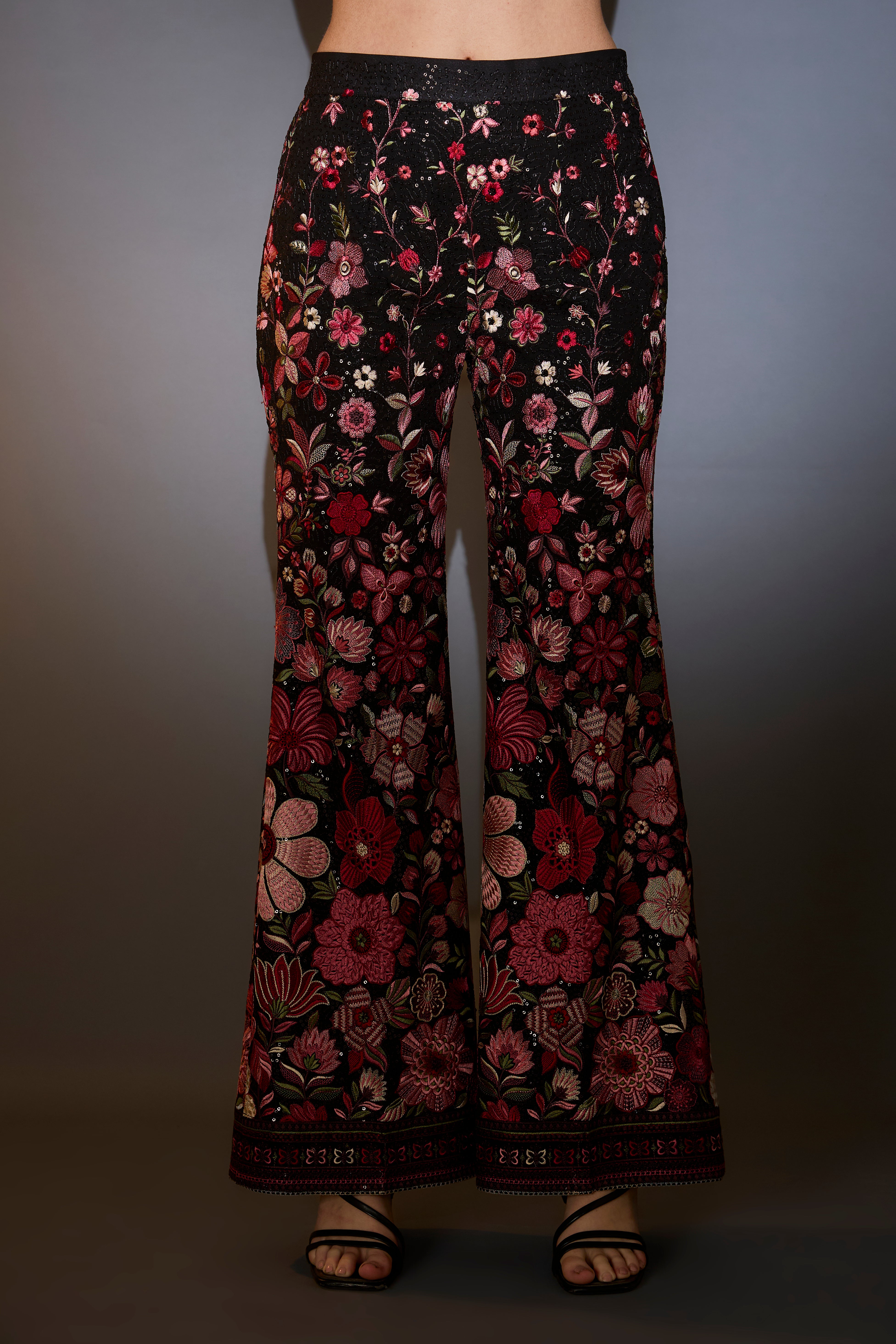 Multi-coloured floral tunic set with boot cut trousers.