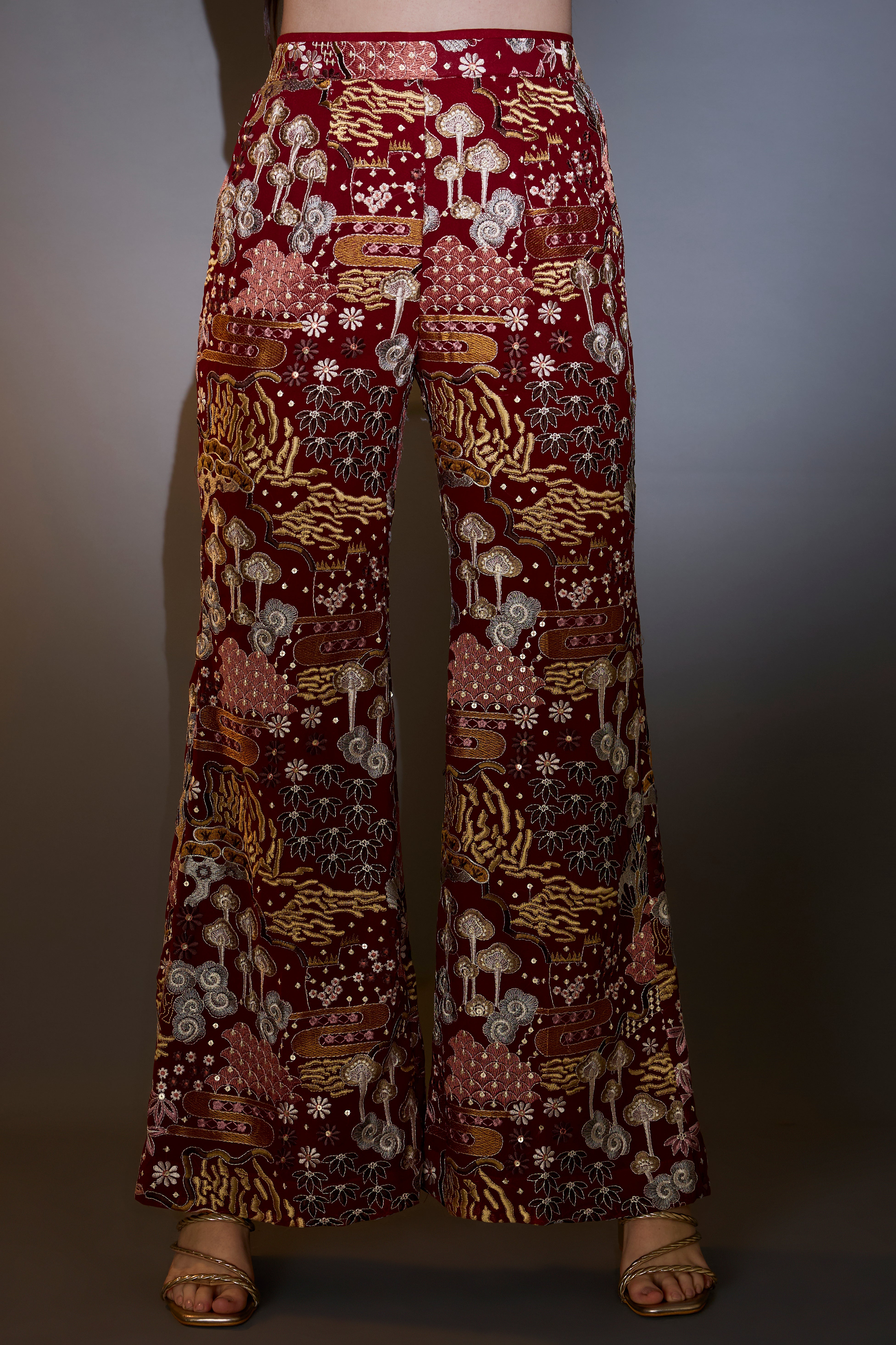 Deep red co-ord set with intricate multi-floral embroidery, embellished with bead tassels.