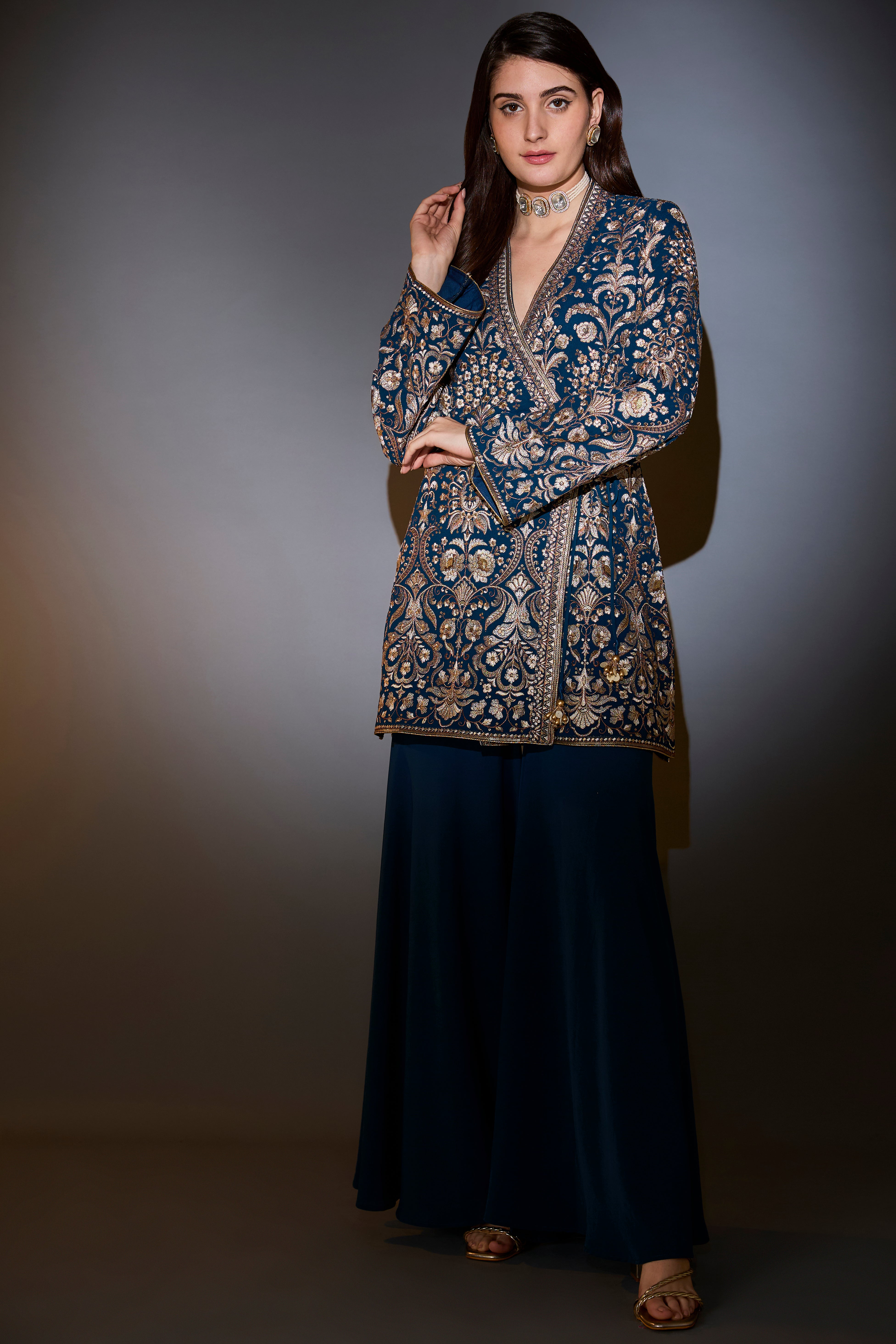 Royal blue angrakha sharara set with intricate thread and zari embroidery.