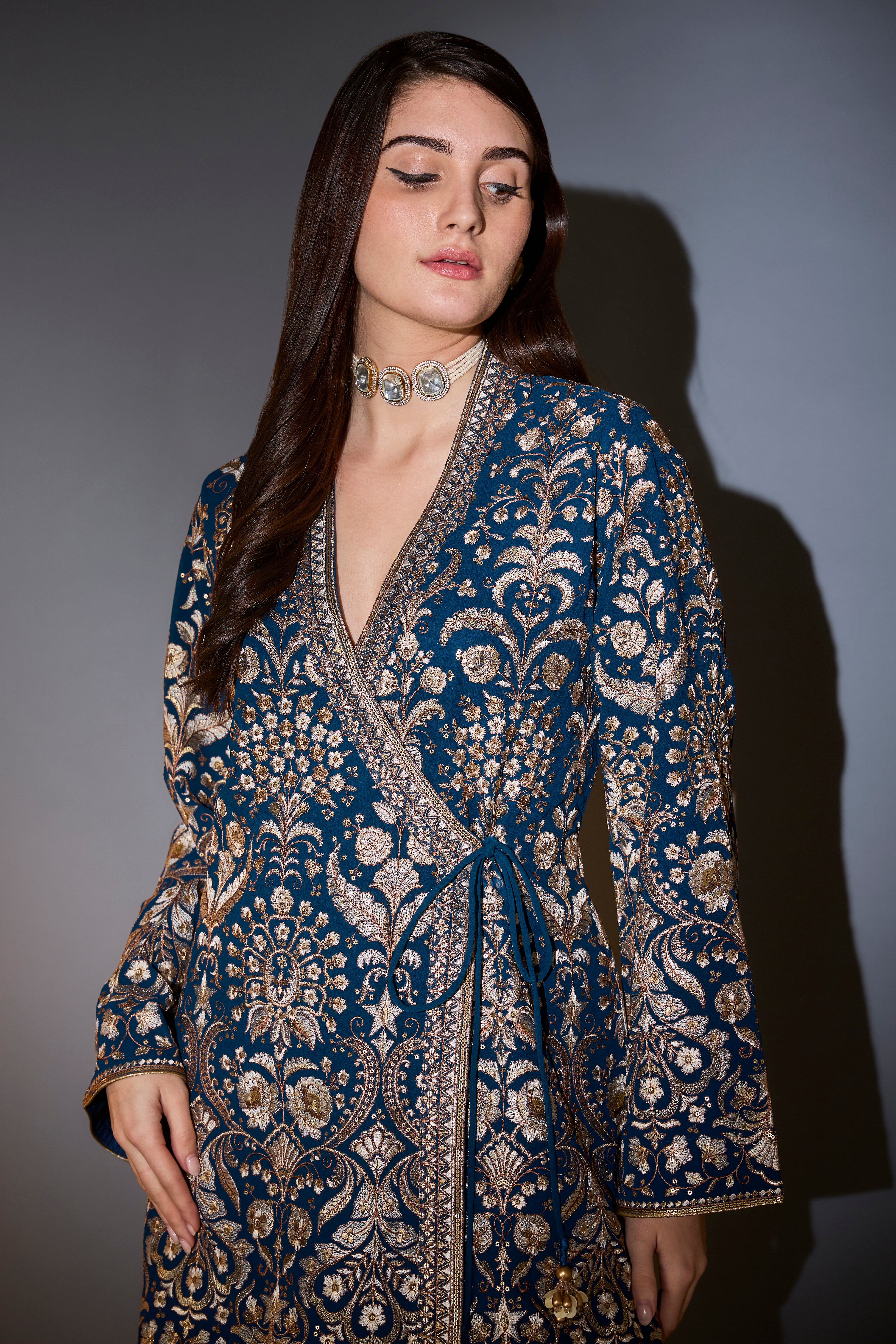 Royal blue angrakha sharara set with intricate thread and zari embroidery.