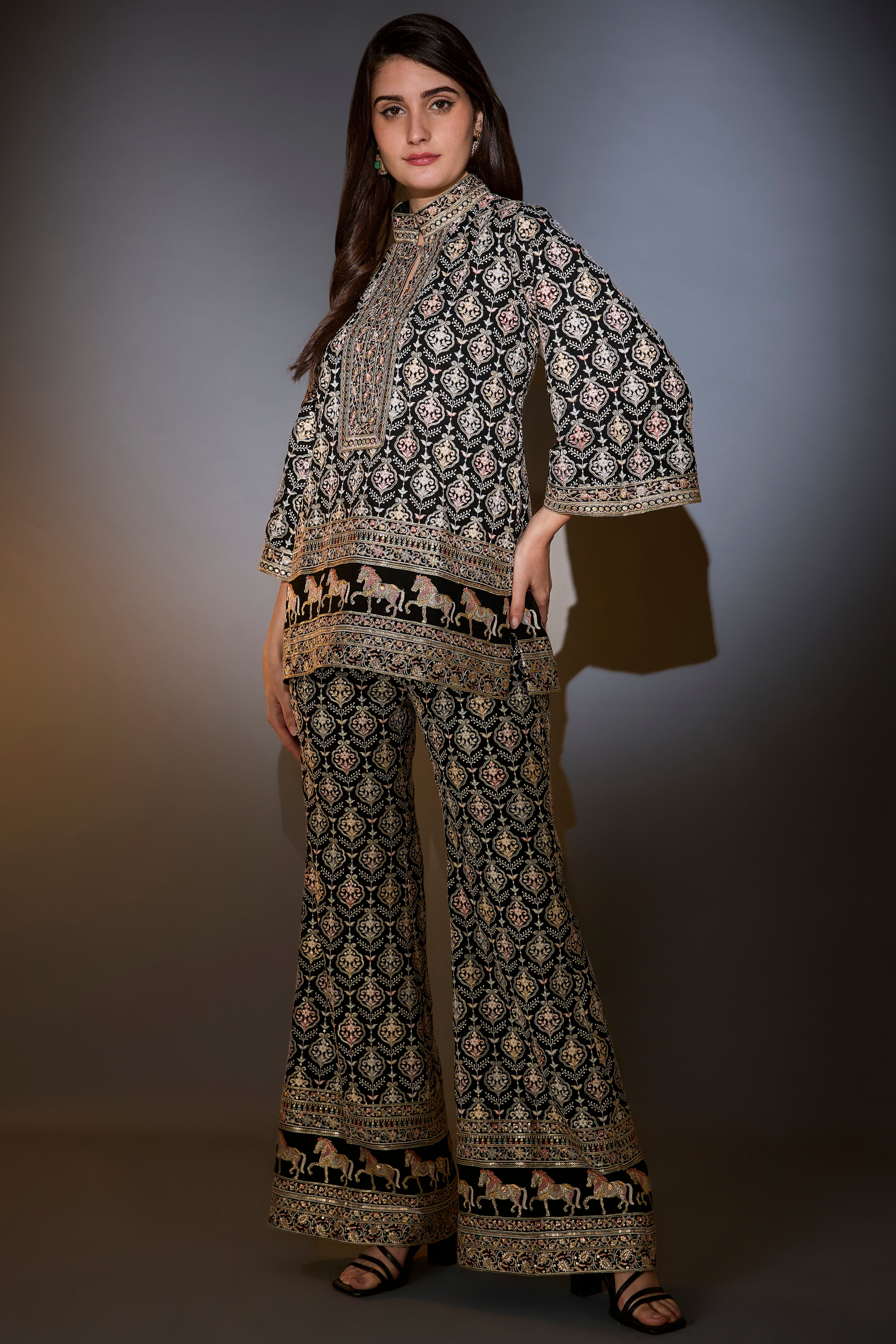 Black multi-thread work co-ord set with horse motifs.