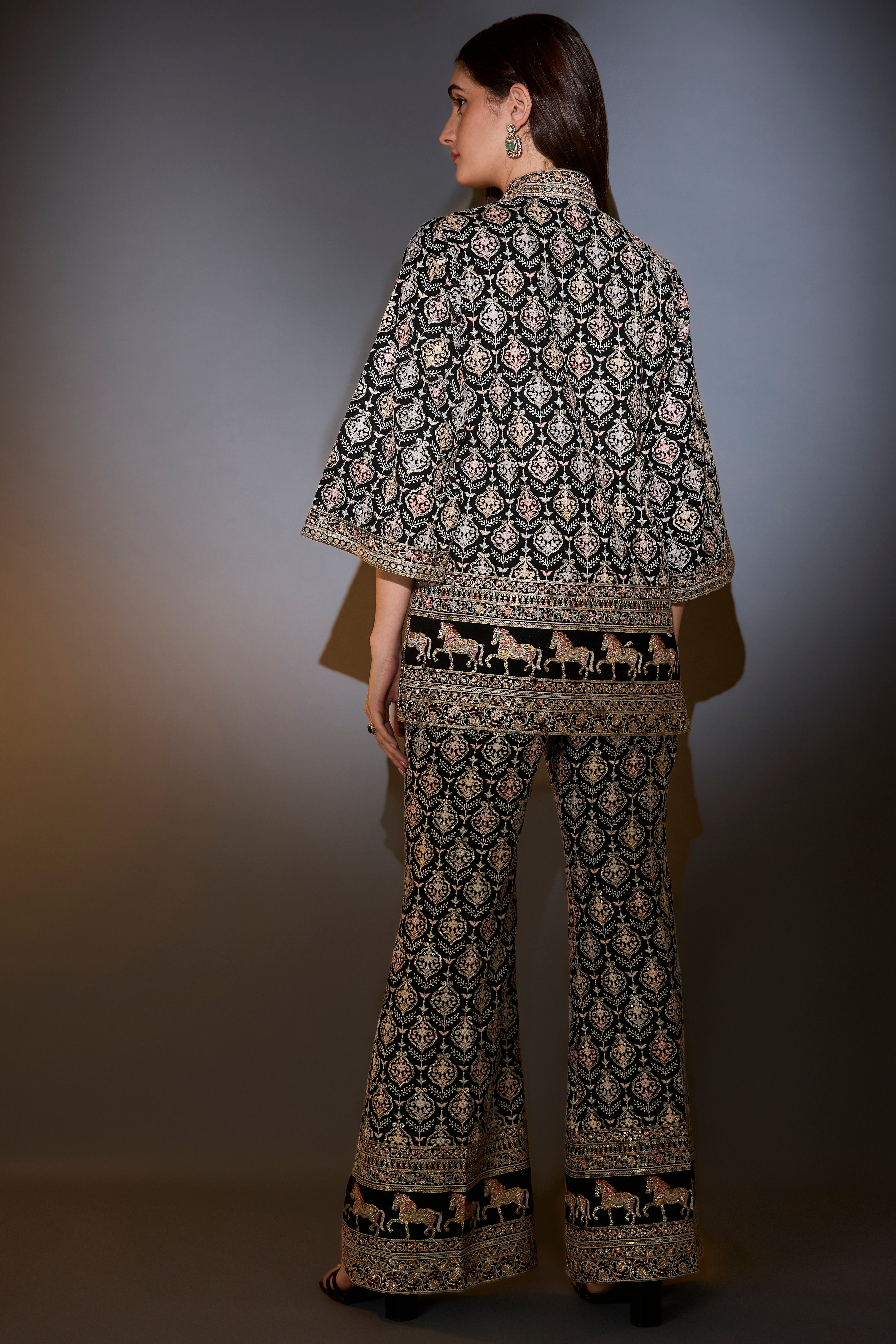 Black multi-thread work co-ord set with horse motifs.