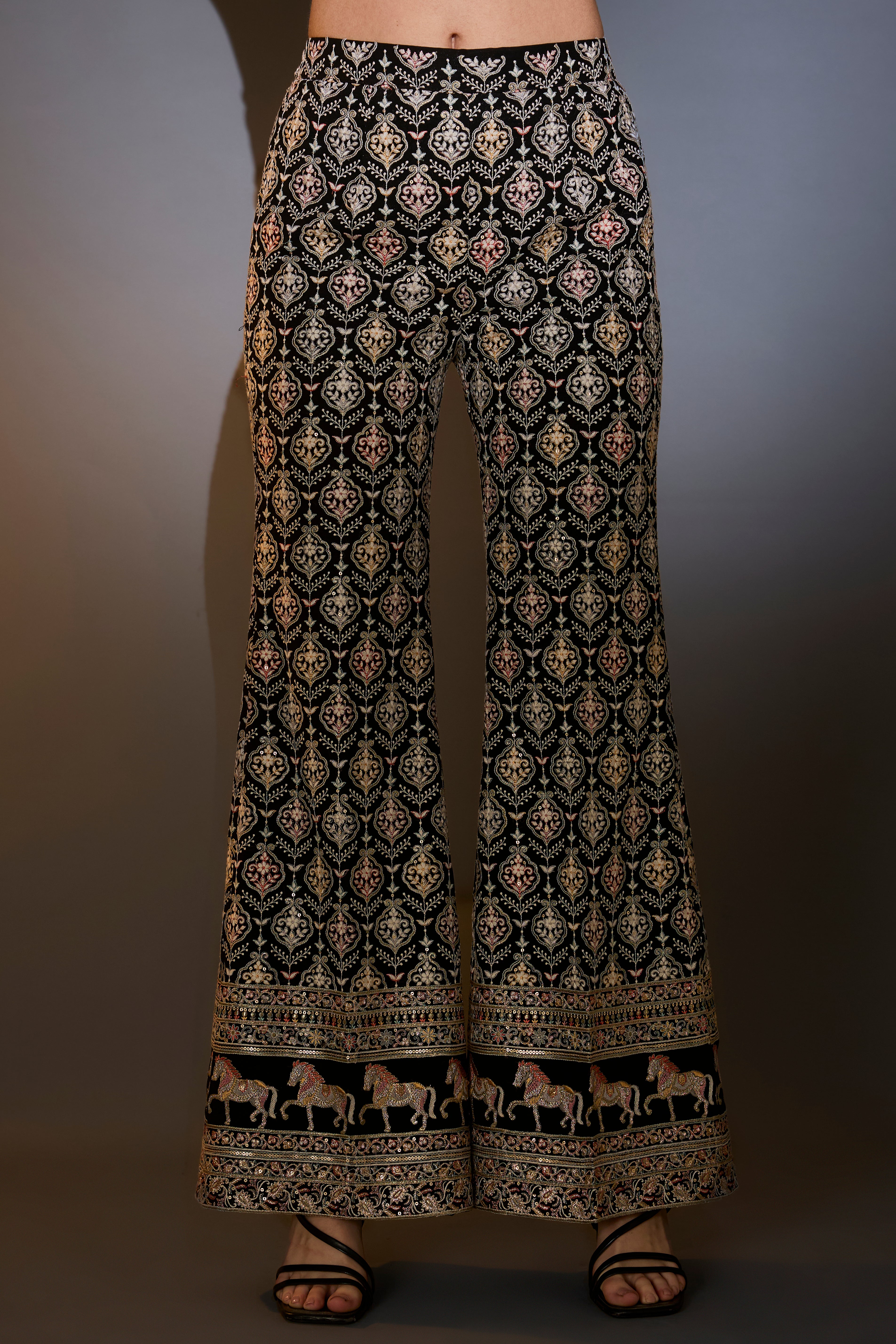 Black multi-thread work co-ord set with horse motifs.