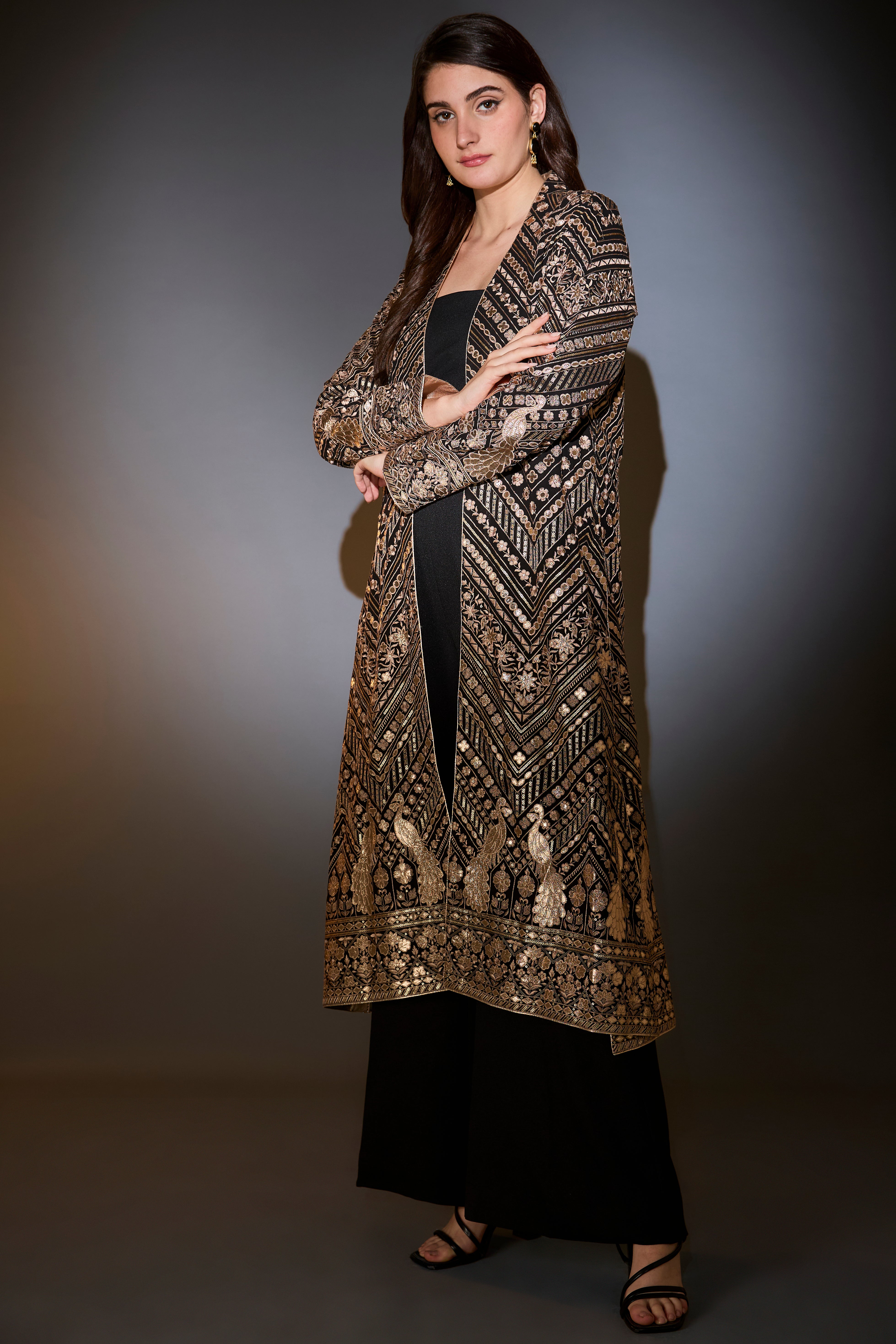 Black jacket set with sharara adorned with heavy gold leather patch embroidery.