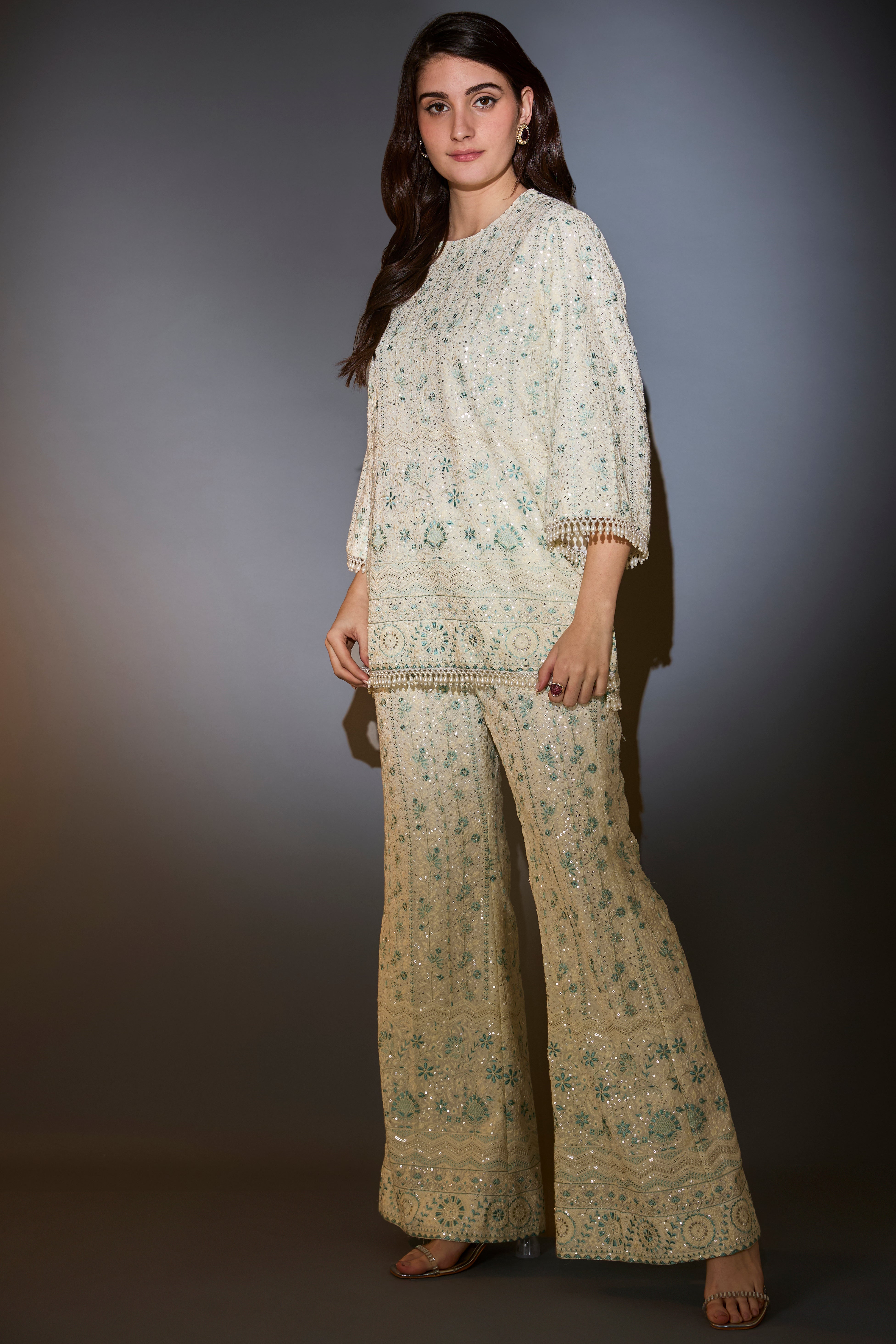 White and aqua chikankari co-ord set with intricate thread and sequin embroidery.