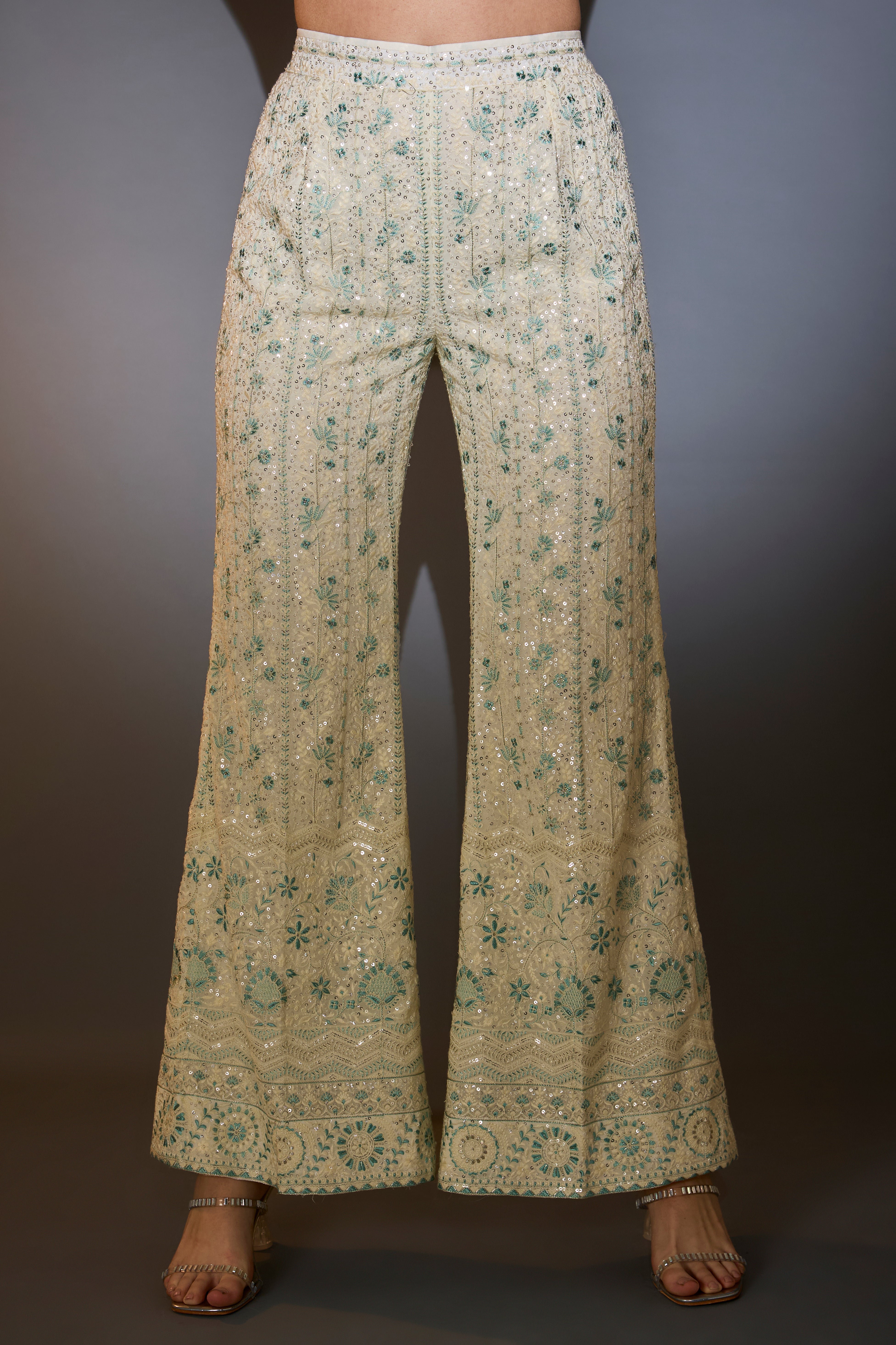 White and aqua chikankari co-ord set with intricate thread and sequin embroidery.