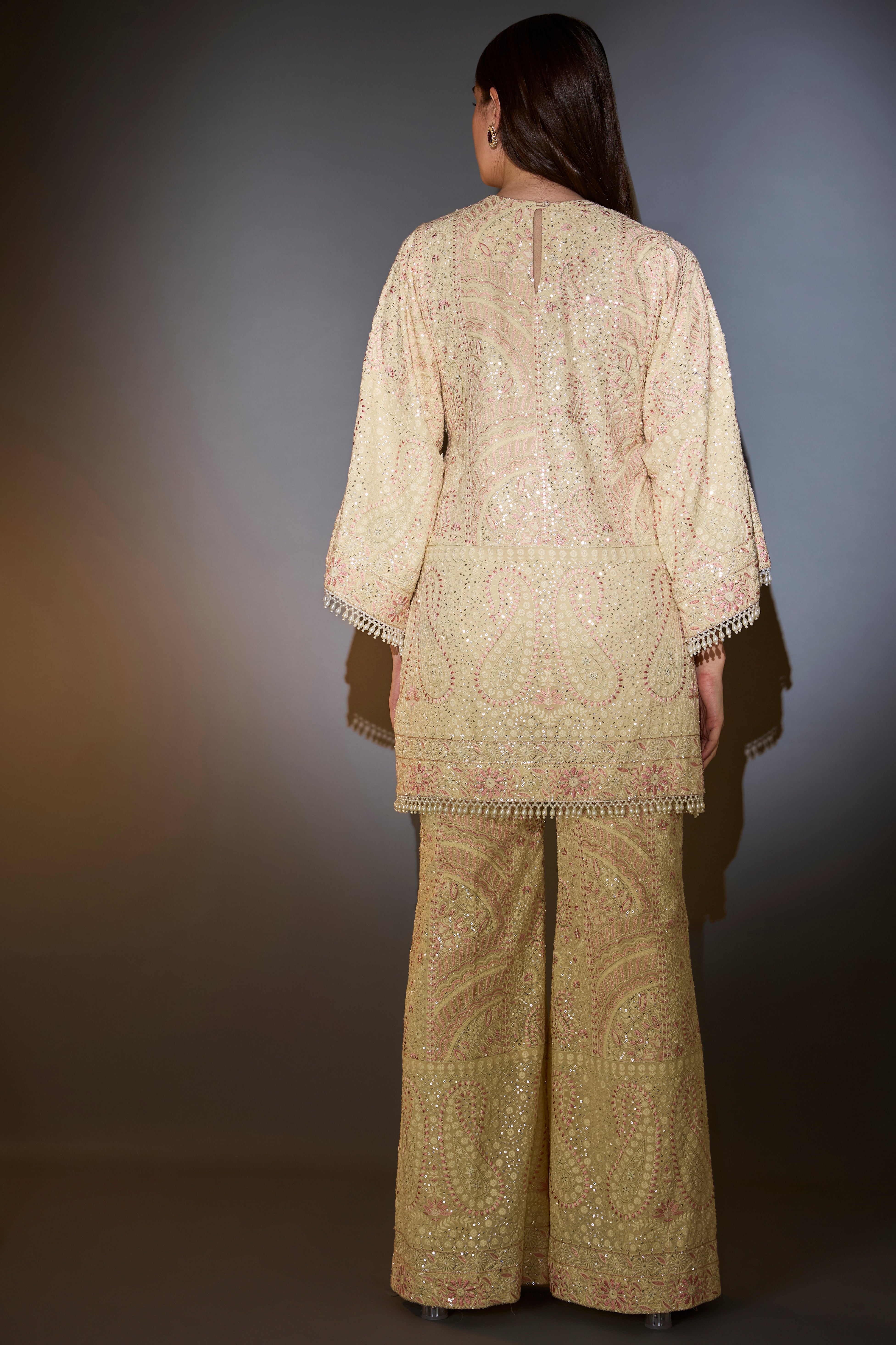 Cream chikankari co-ord set with intricate pink thread work and sequin embroidery.