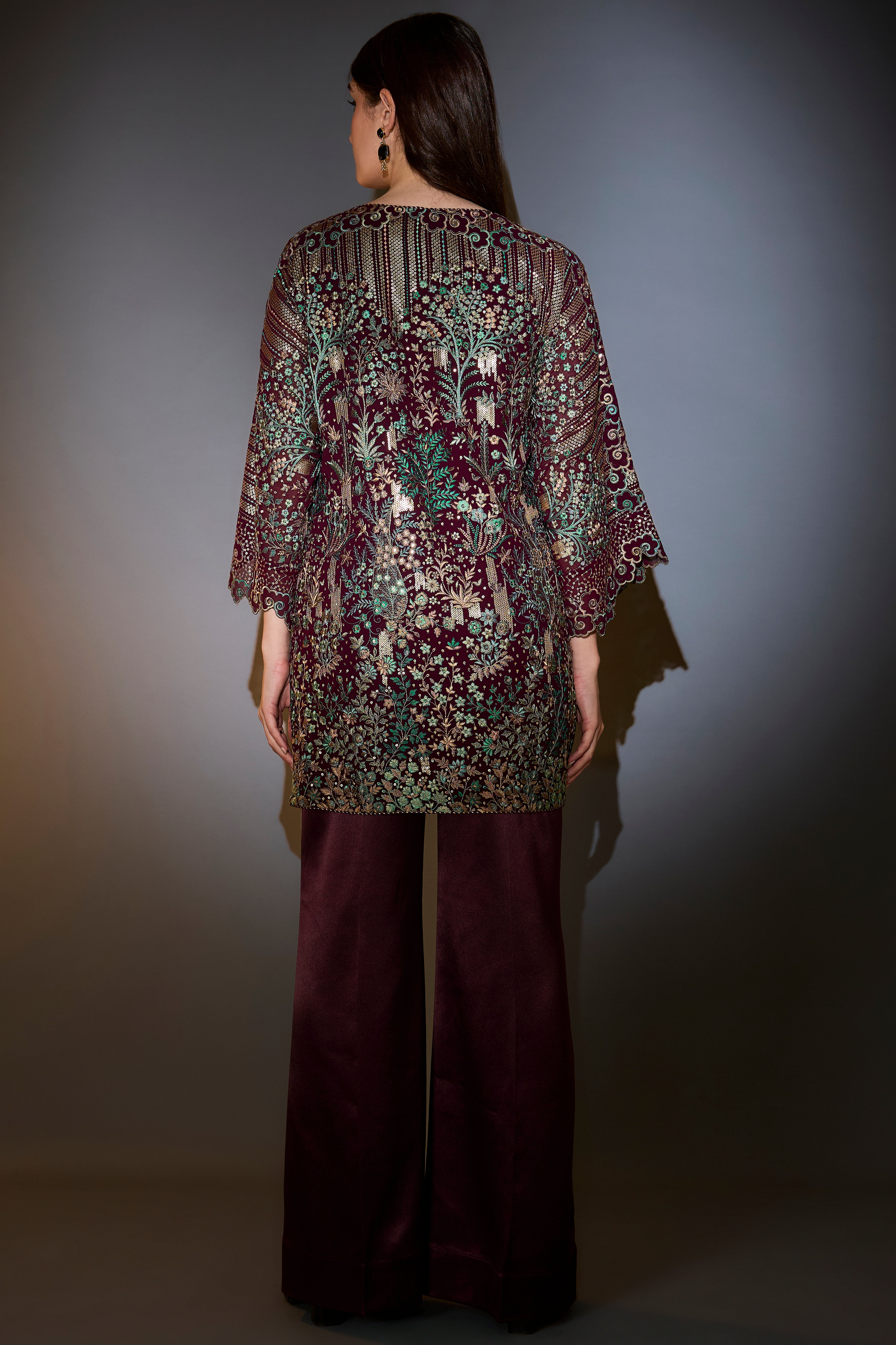 Wine co-ord set with heavy multi-thread embroidery and flora and fauna motifs.