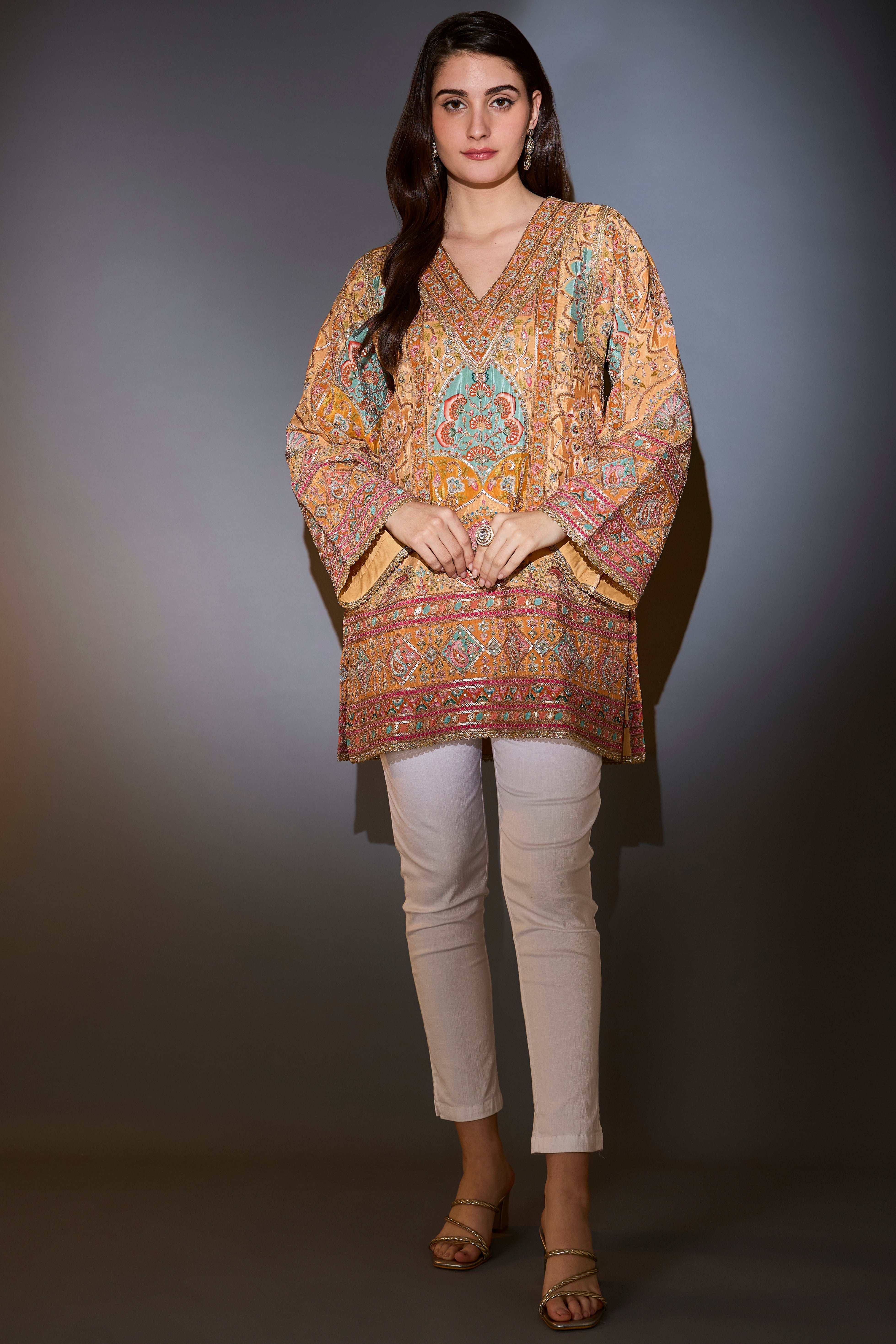 Mustard tunic with intricate multi-thread and aari work.