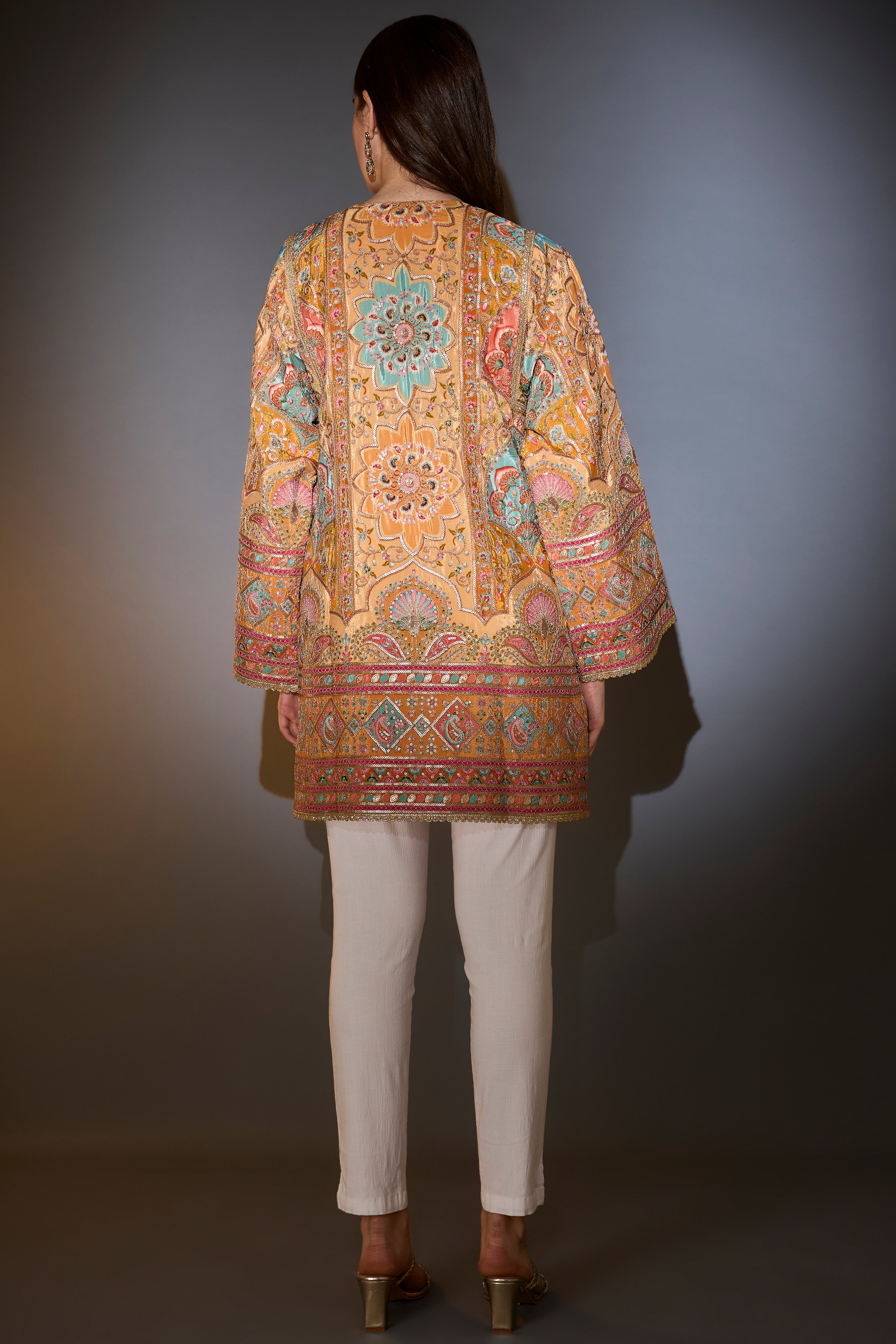 Mustard tunic with intricate multi-thread and aari work.