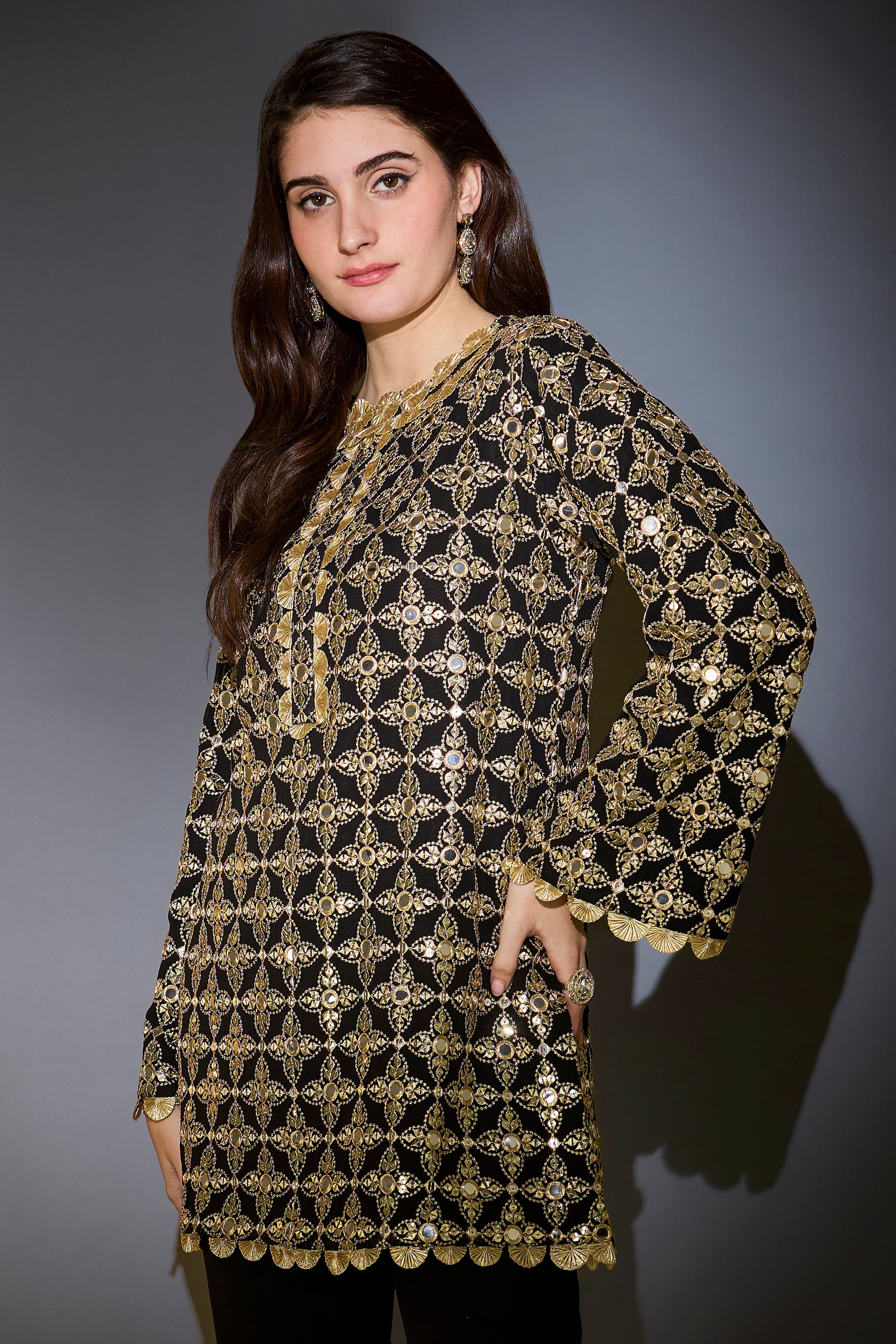 Heavy black tunic with intricate mirror and zari work, with detailed gota edgings.