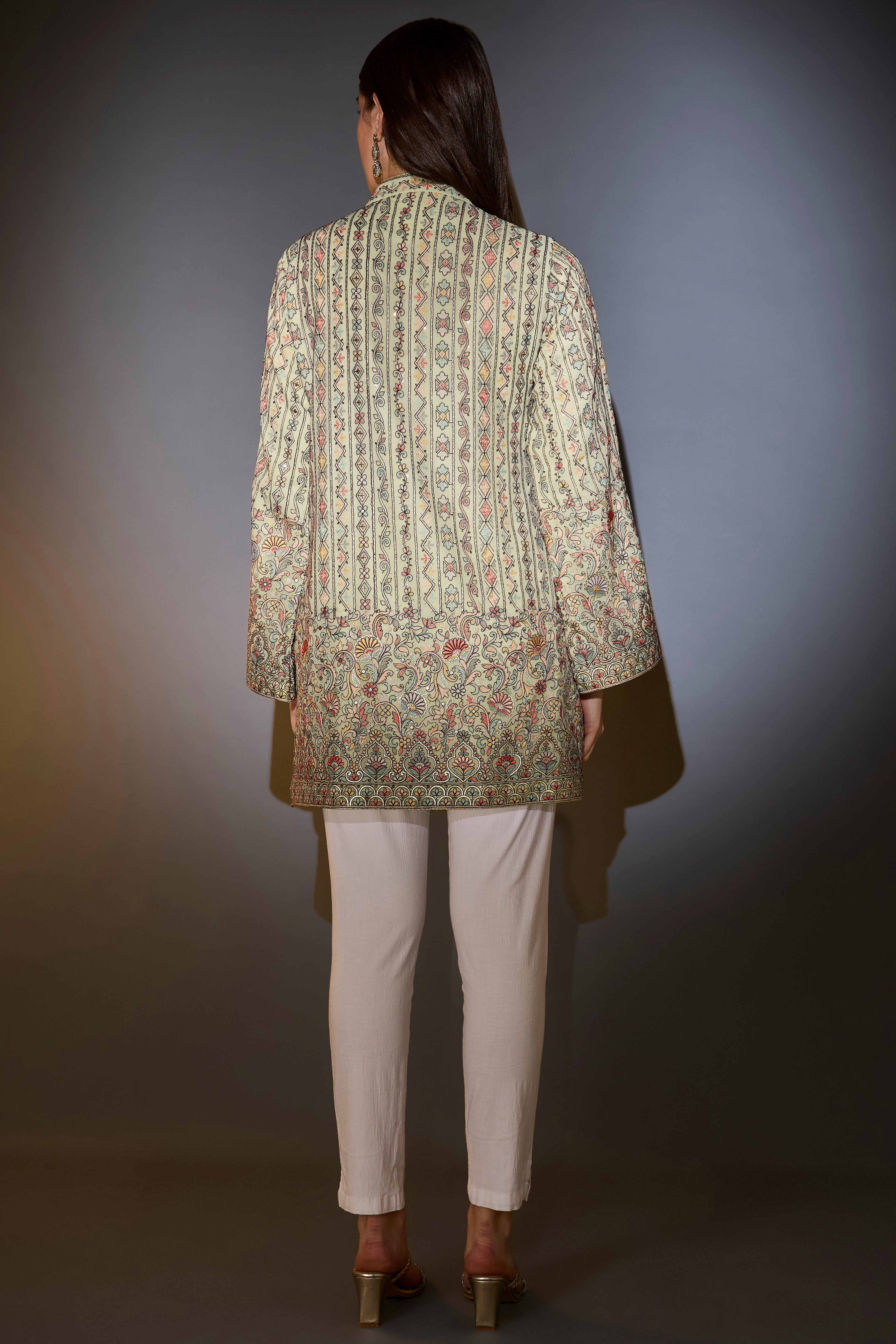 Mint green tunic with multi-thread embroidery.