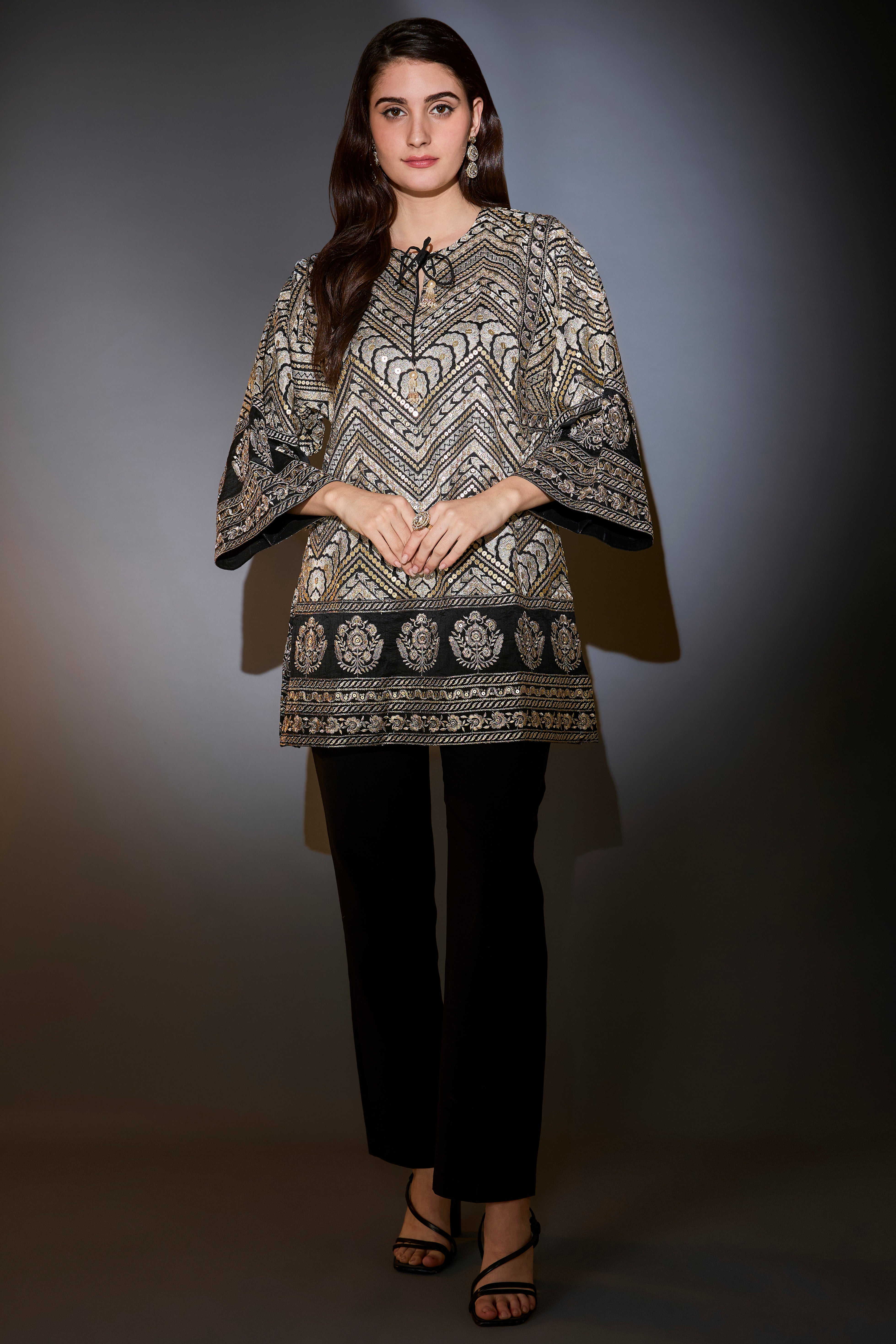 Black tunic with heavy zari and gota work, sprinkled with sequins.