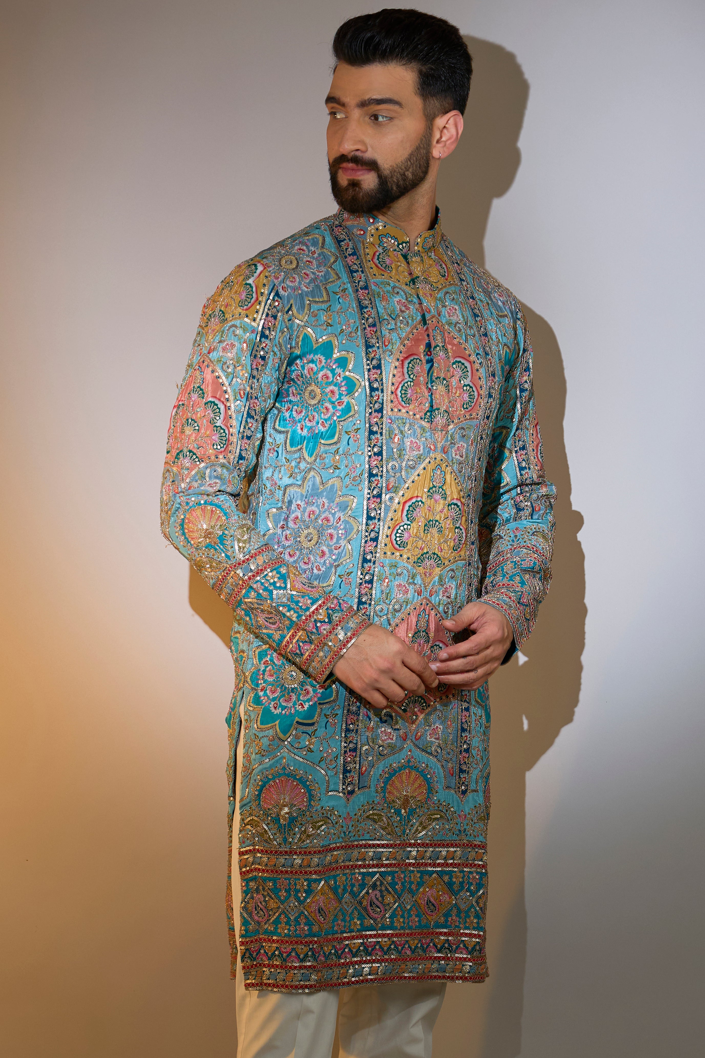 blue embrodried kurta on print with intricate zari detailing