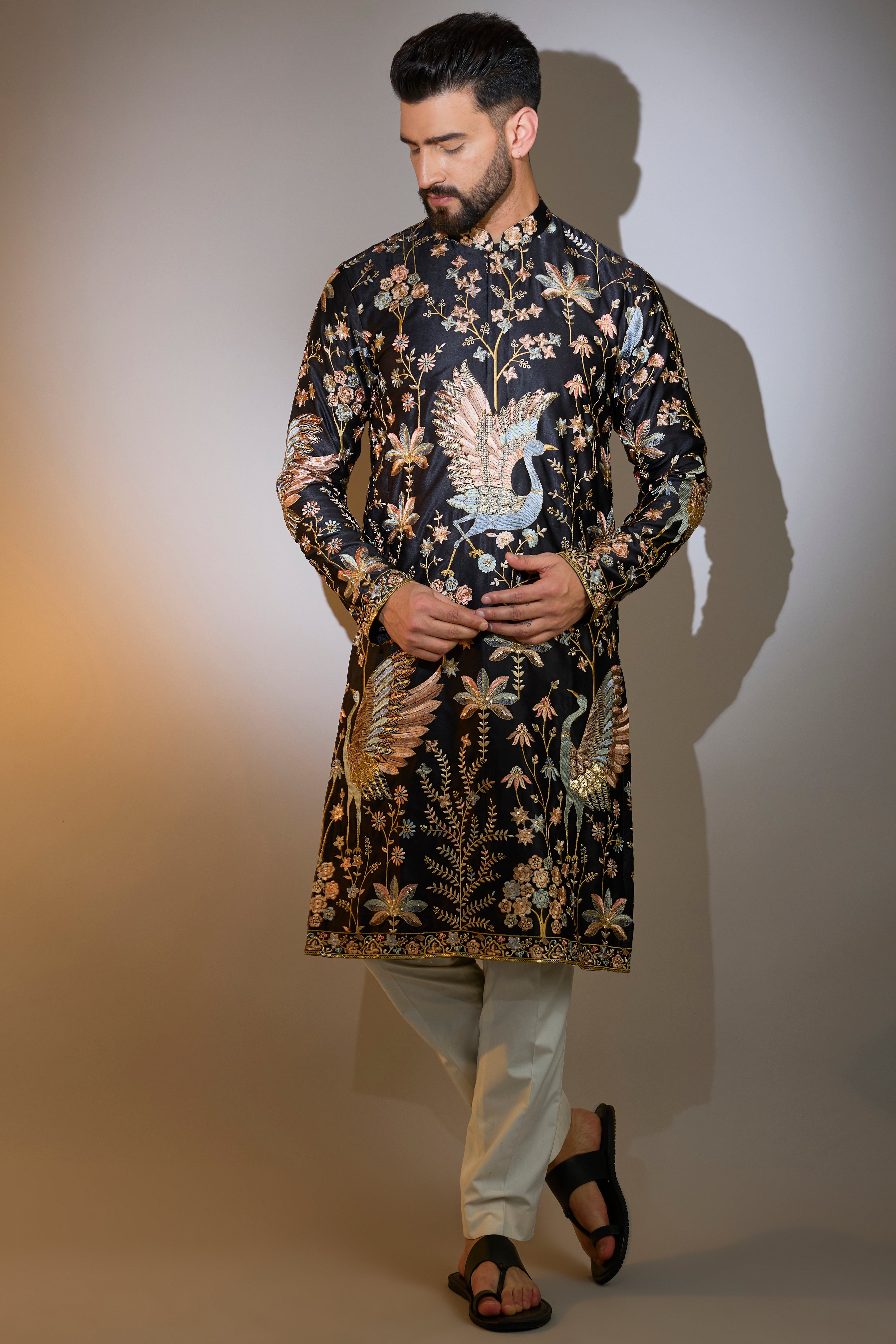 black thread work kurta with intricate flora and fauna embroidery