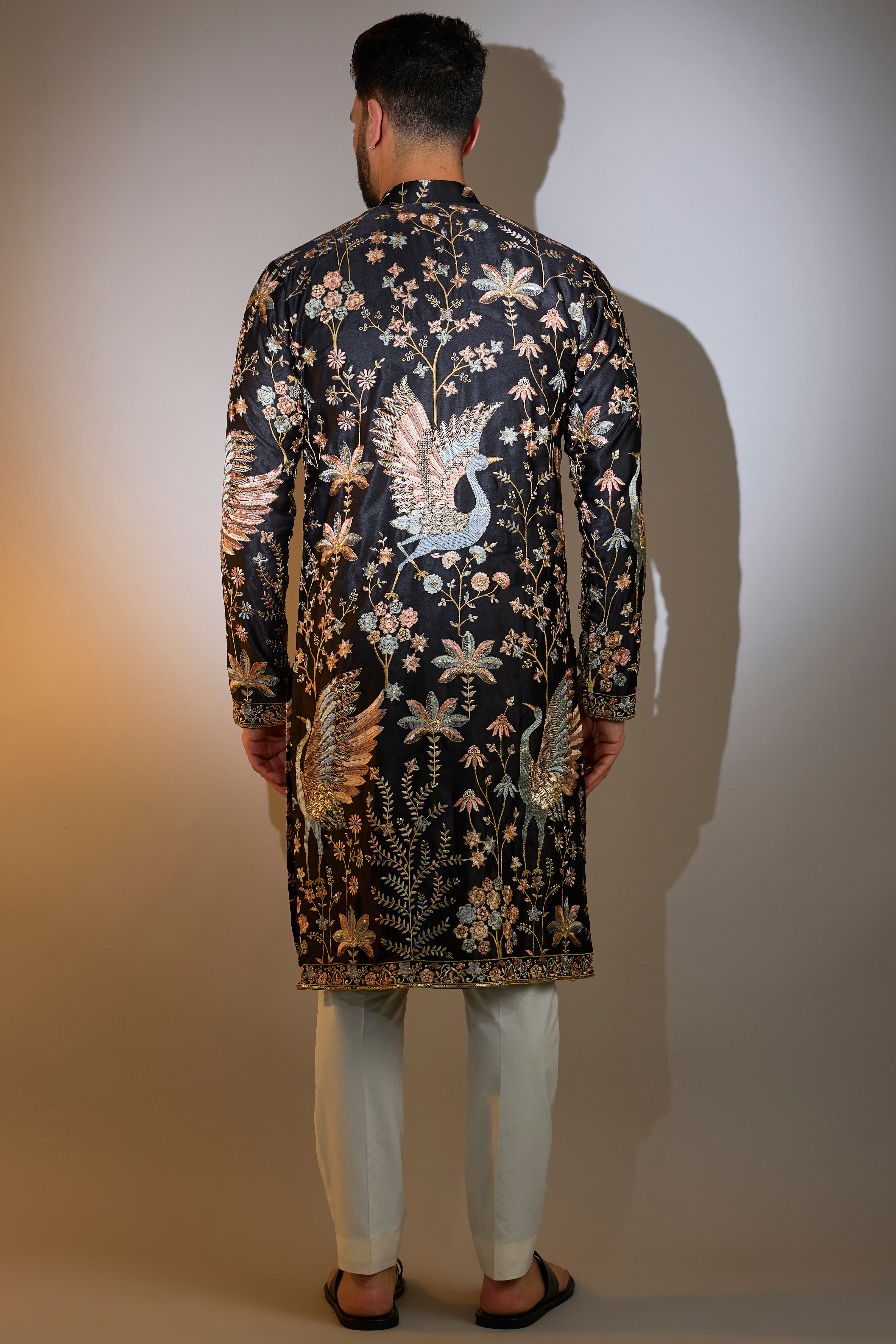 black thread work kurta with intricate flora and fauna embroidery