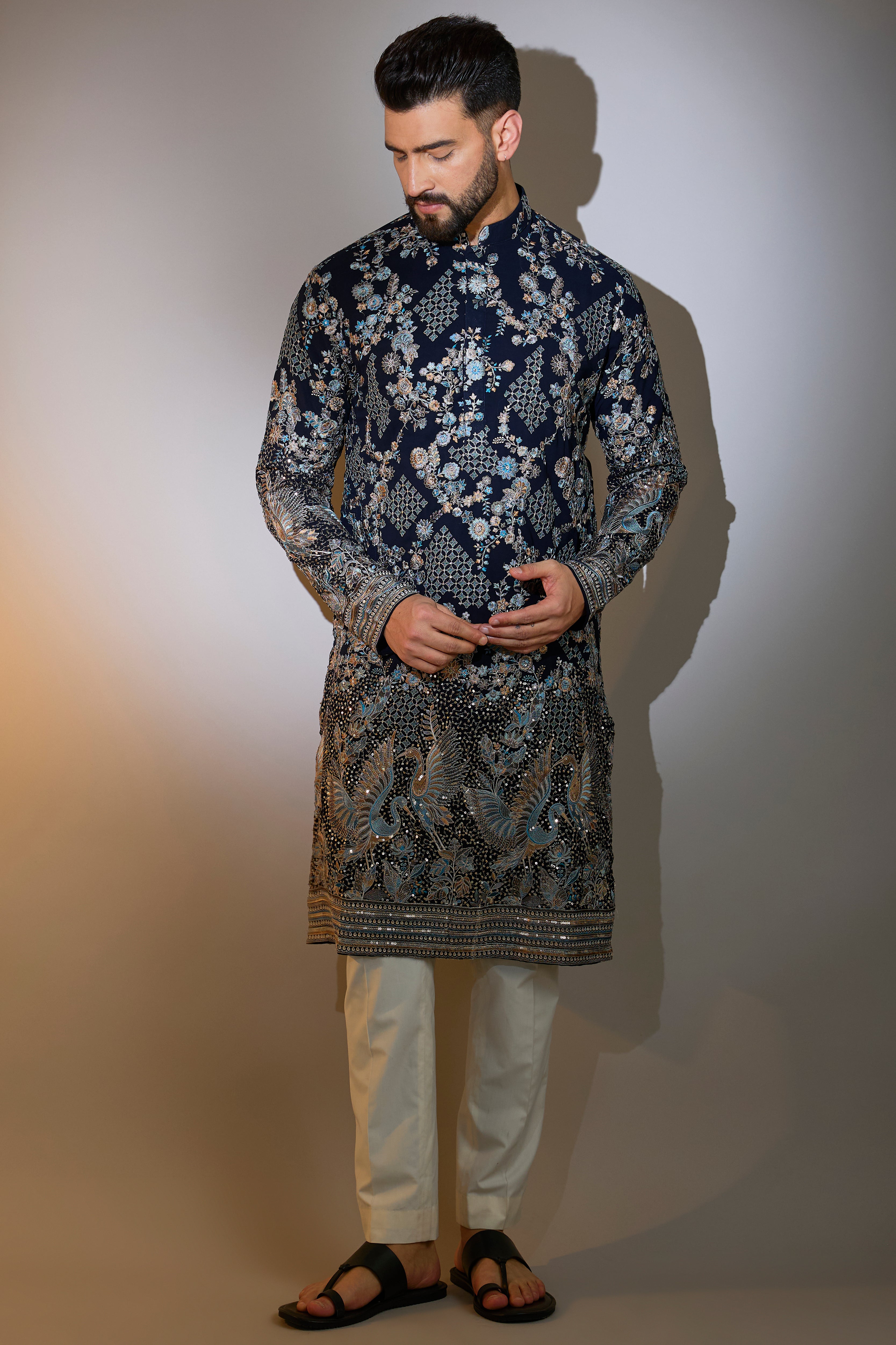 blue chikankari kurta with intriacte flora and fauna embroidery