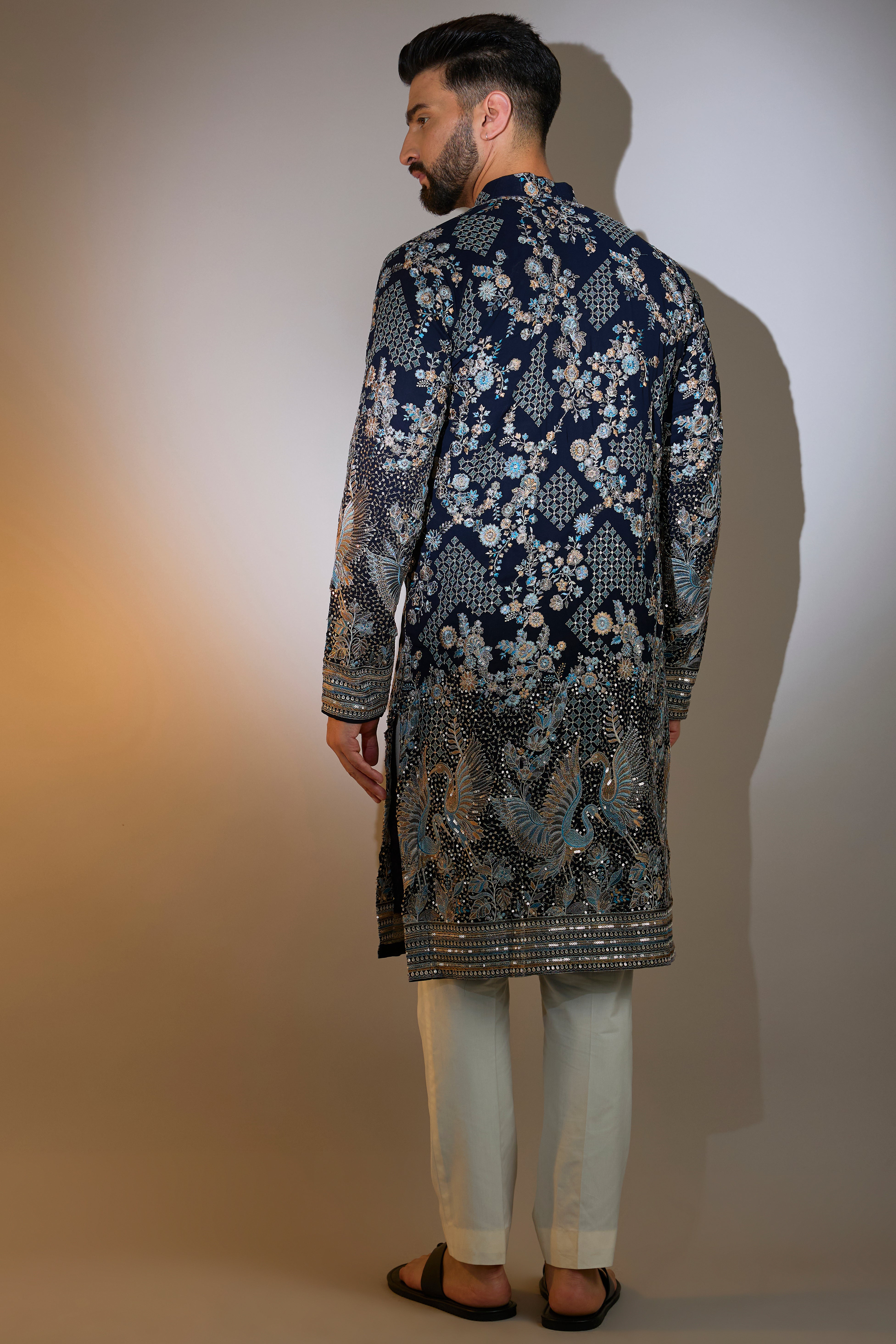 blue chikankari kurta with intriacte flora and fauna embroidery