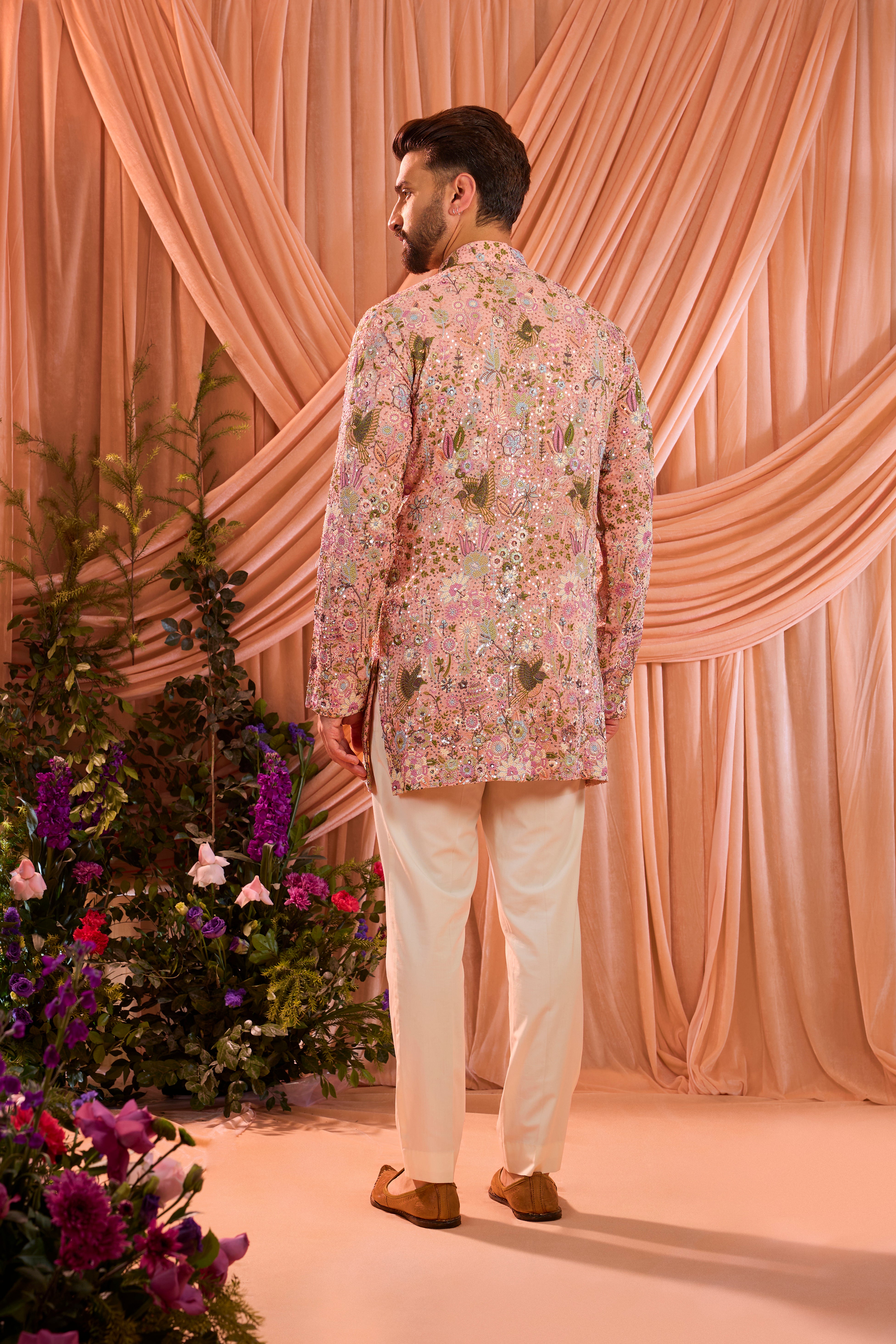 Pink sequined kurta with detailed flora and fauna figures and multi thread work