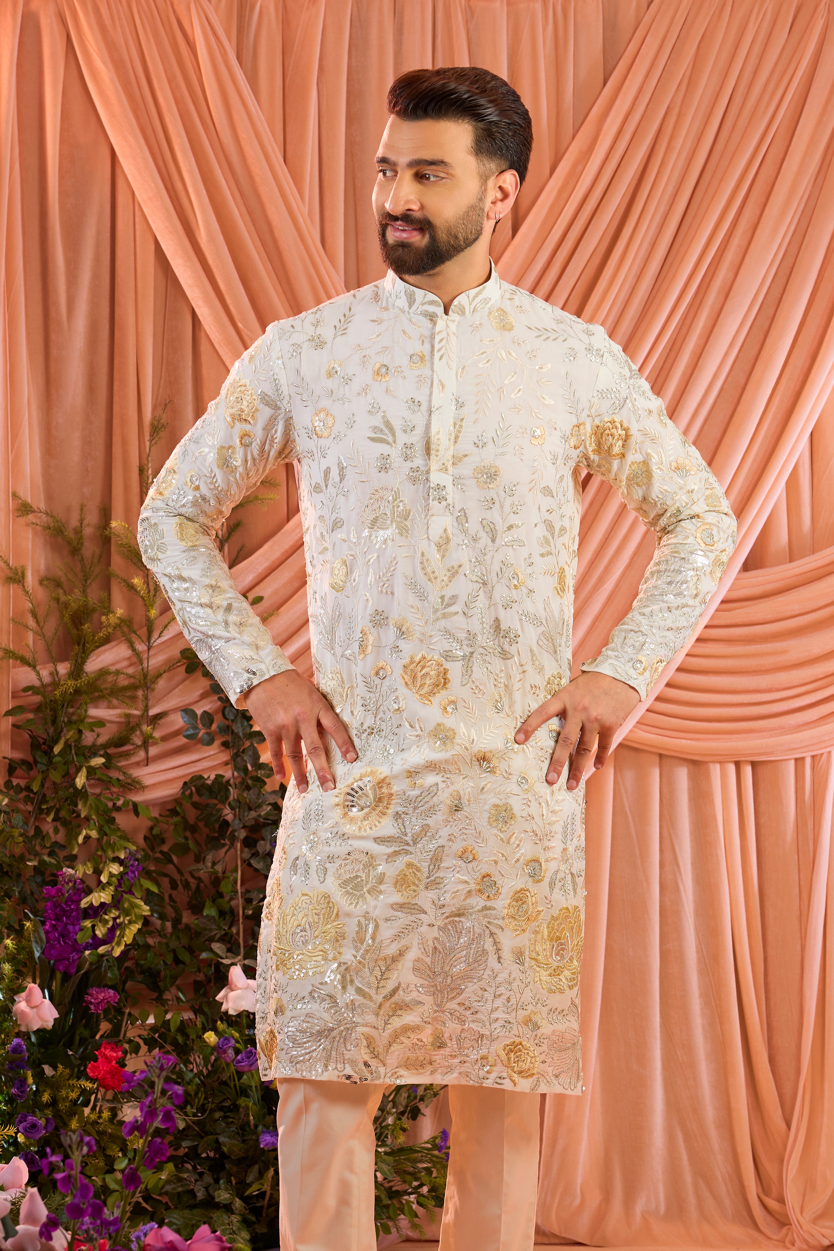 White  floral  kurta adorned with intricate multi-thread embroidery and subtle sequin highlights.