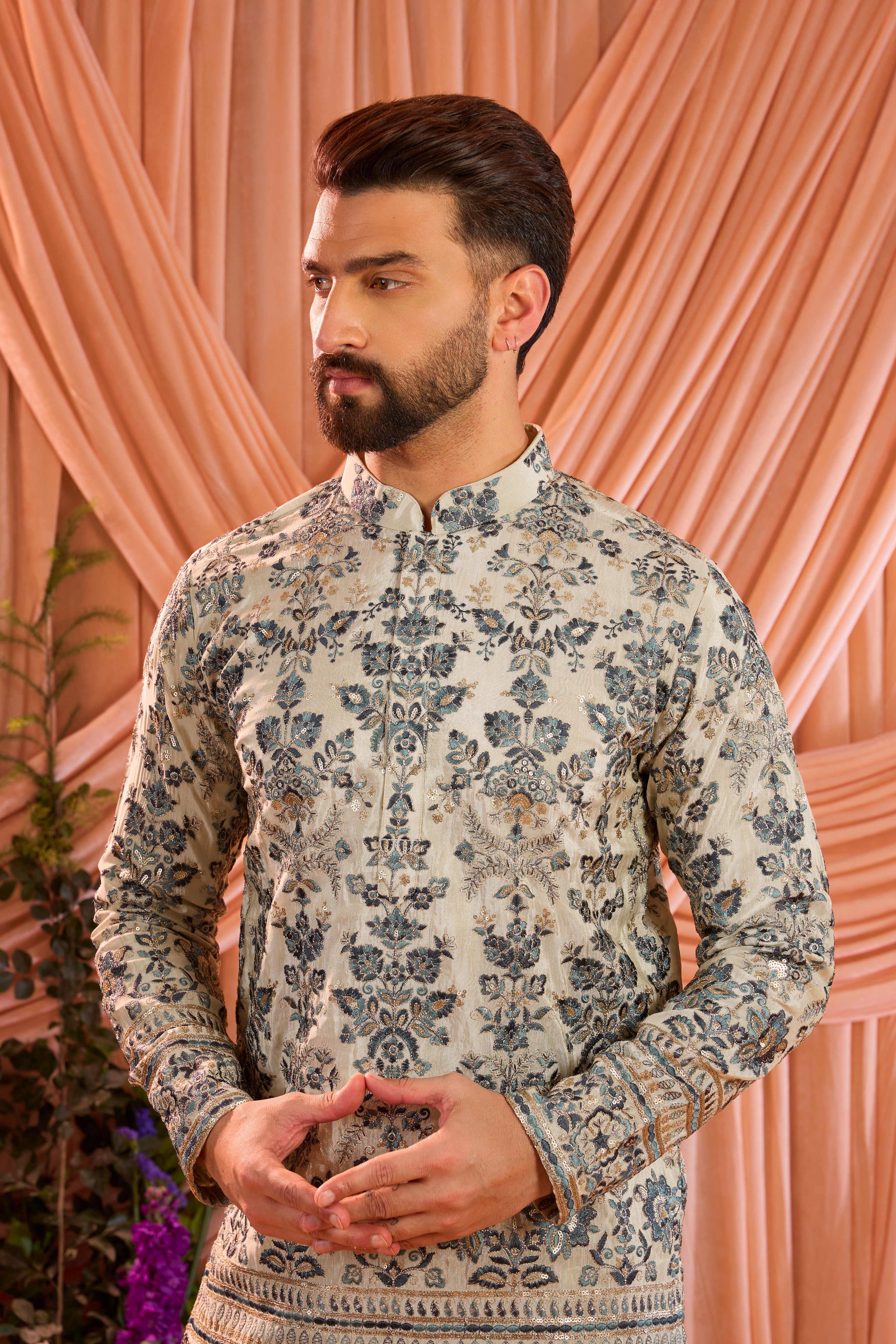 Light golden short floral chikankari kurta with blue threadwork