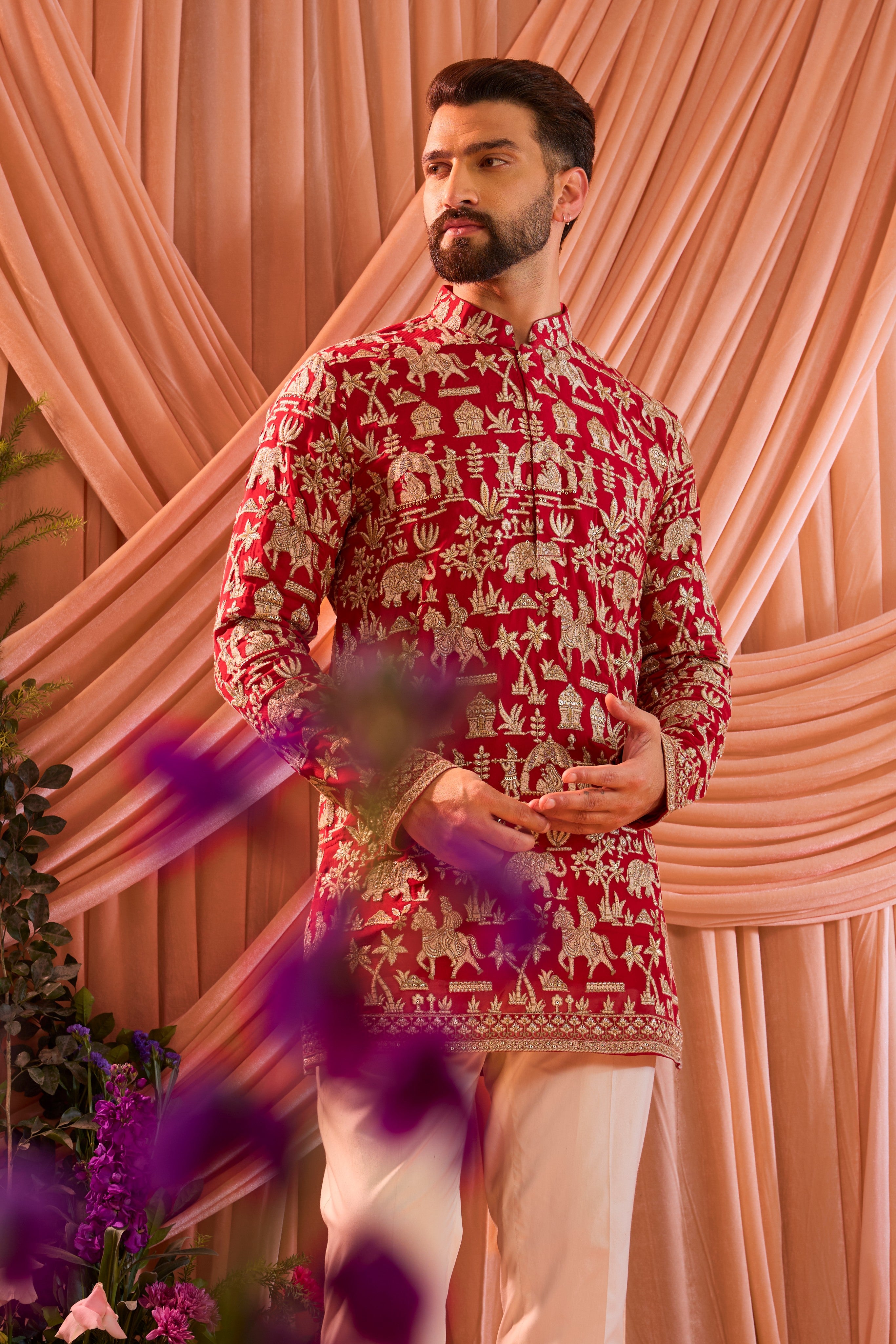 Hot pink royal-heritage kurta adorned with intricately detailed Mughal-era motifs, reflecting the grandeur of imperial artistry.