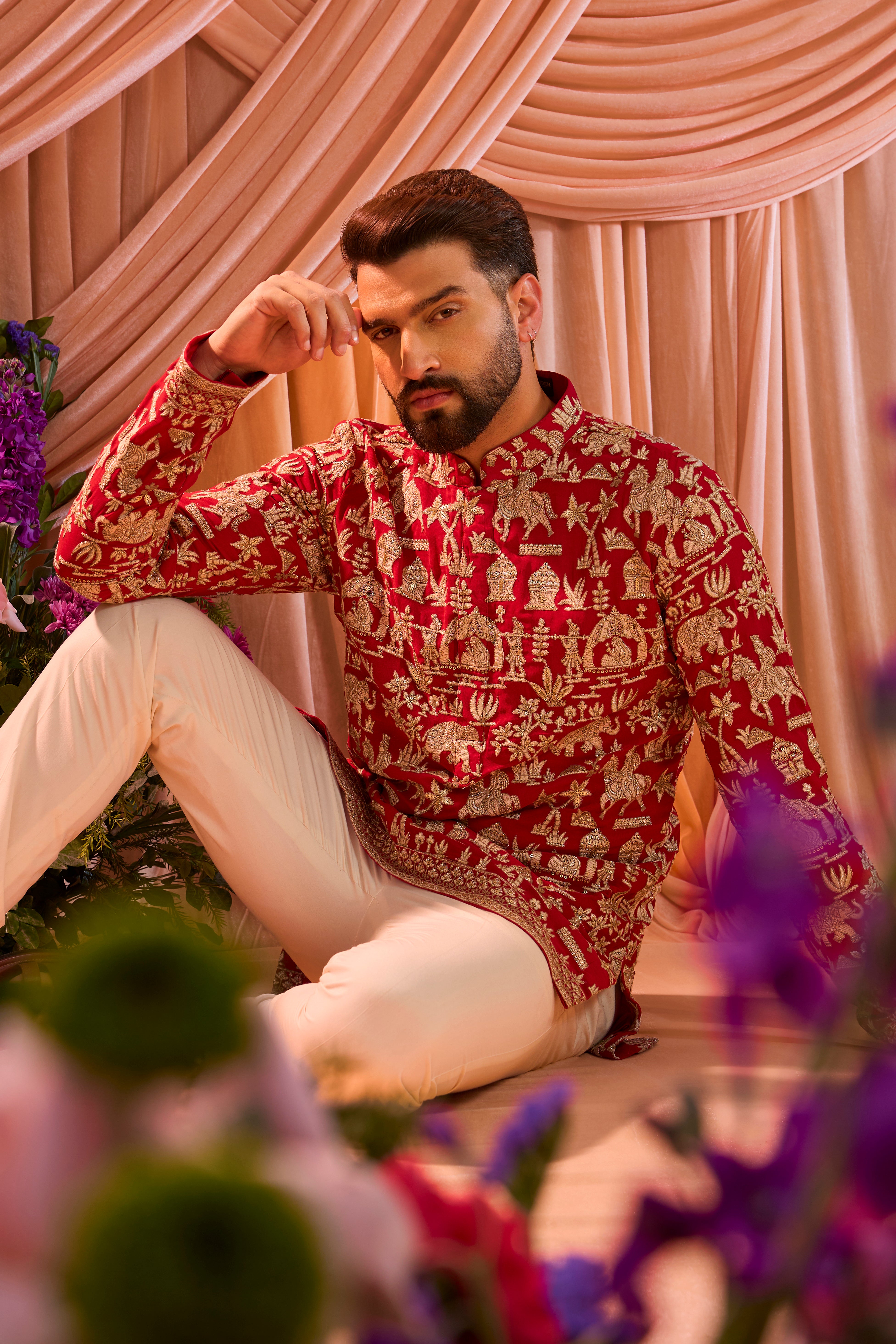 Hot pink royal-heritage kurta adorned with intricately detailed Mughal-era motifs, reflecting the grandeur of imperial artistry.