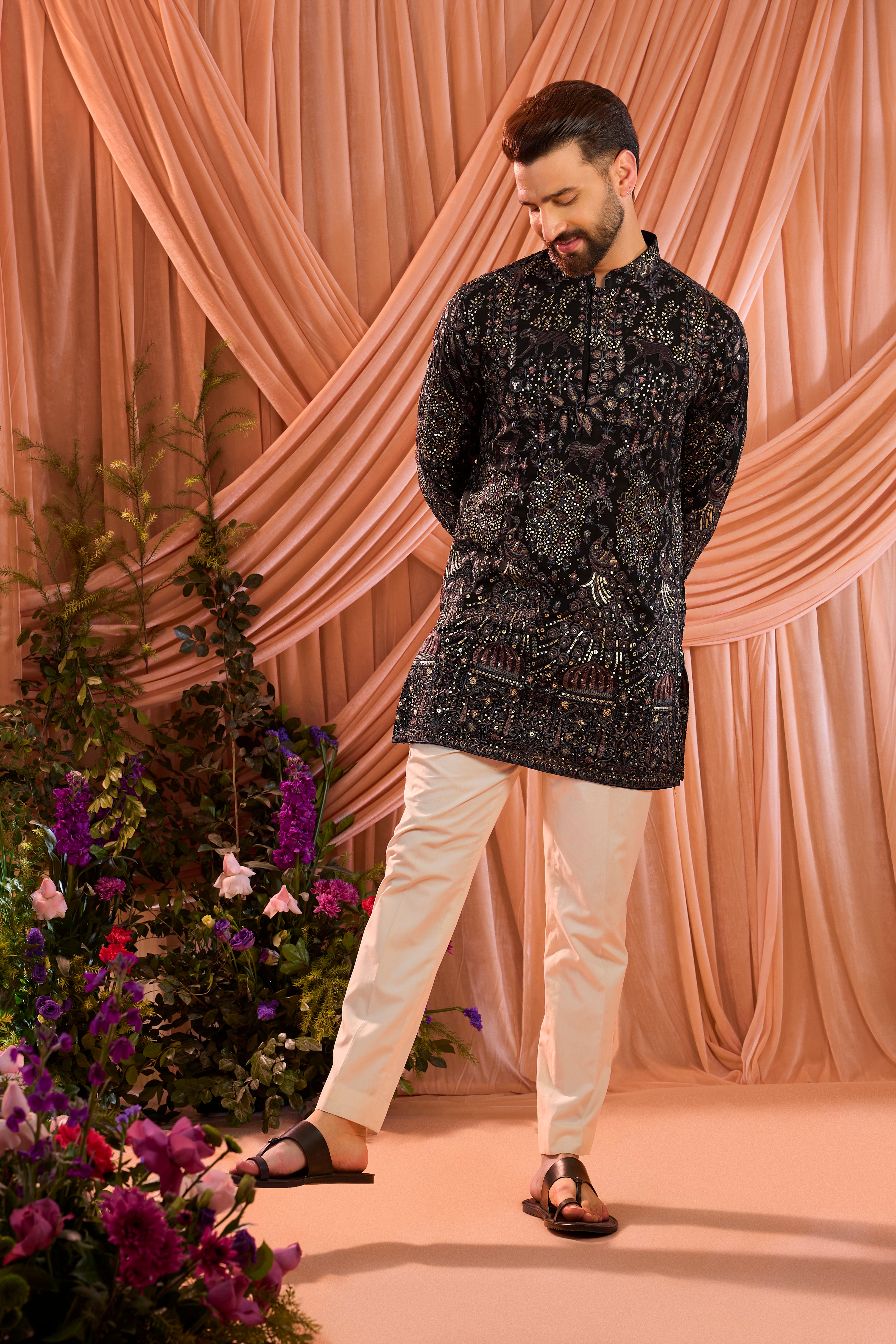 A blue/multi coloured royal heritage kurta adorned with detailed flora and fauna motifs and intricate darbar scenes.