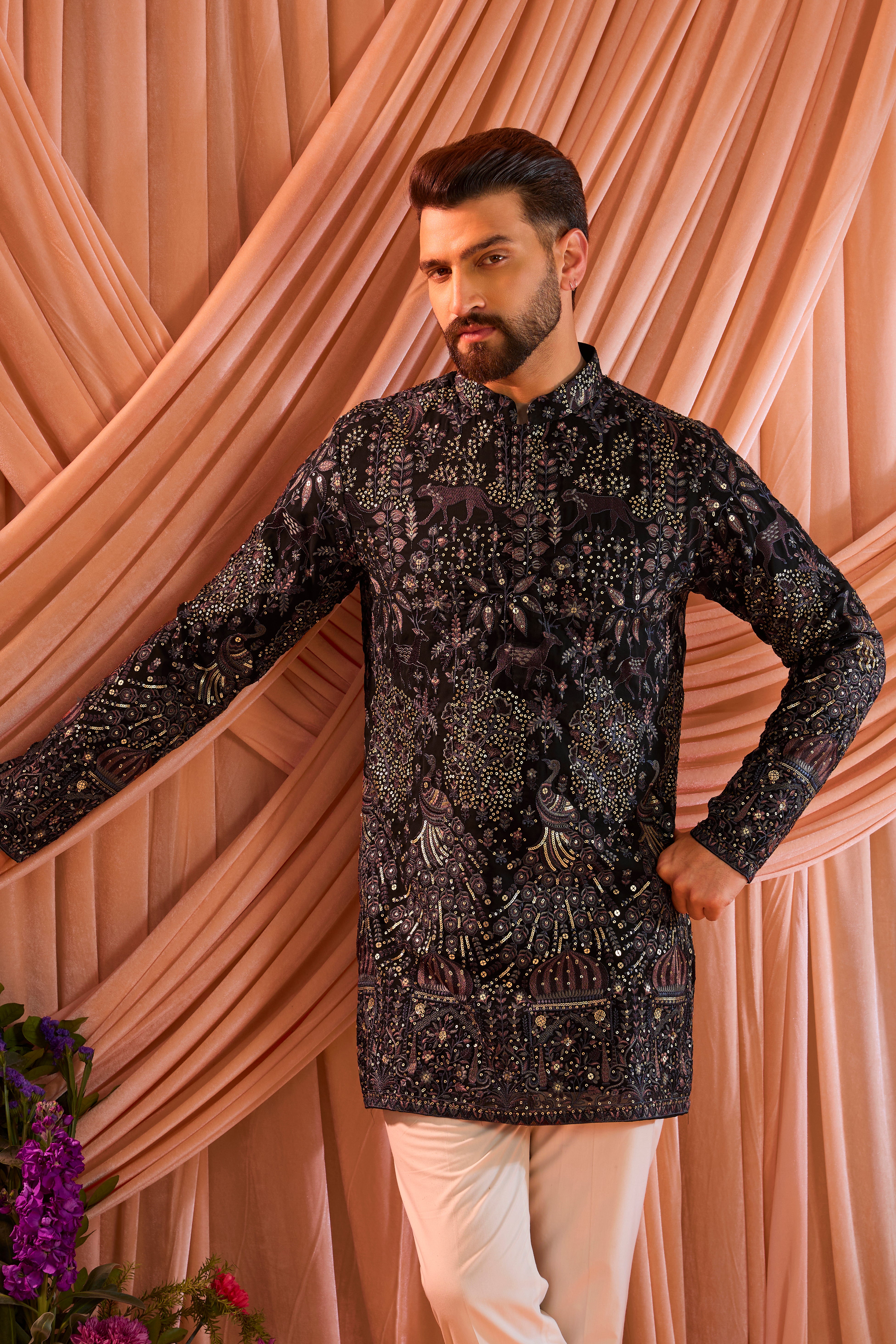 A blue/multi coloured royal heritage kurta adorned with detailed flora and fauna motifs and intricate darbar scenes.