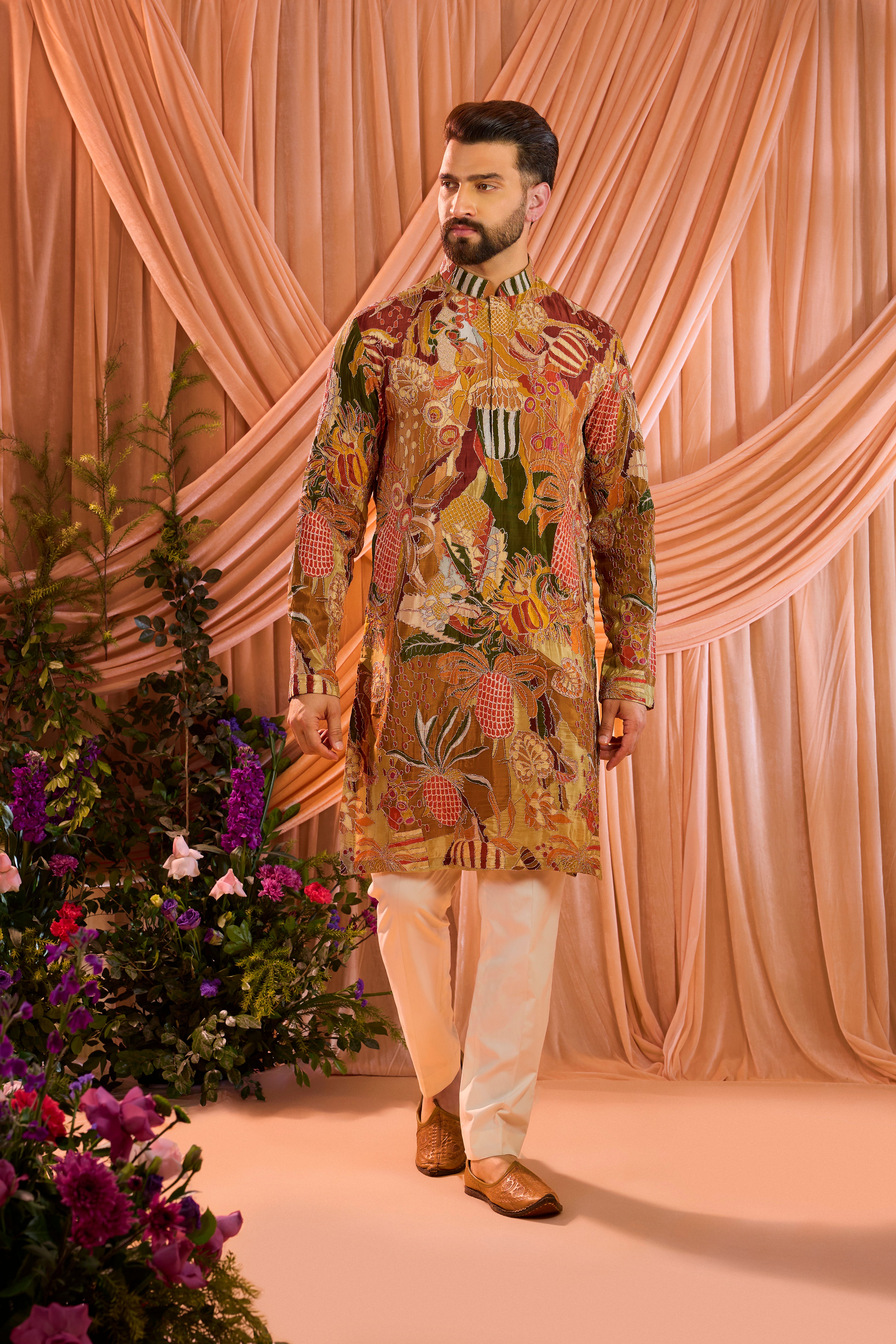 A multicoloured abstract kurta crafted on fluid crepe, elevated with meticulously detailed zari work.