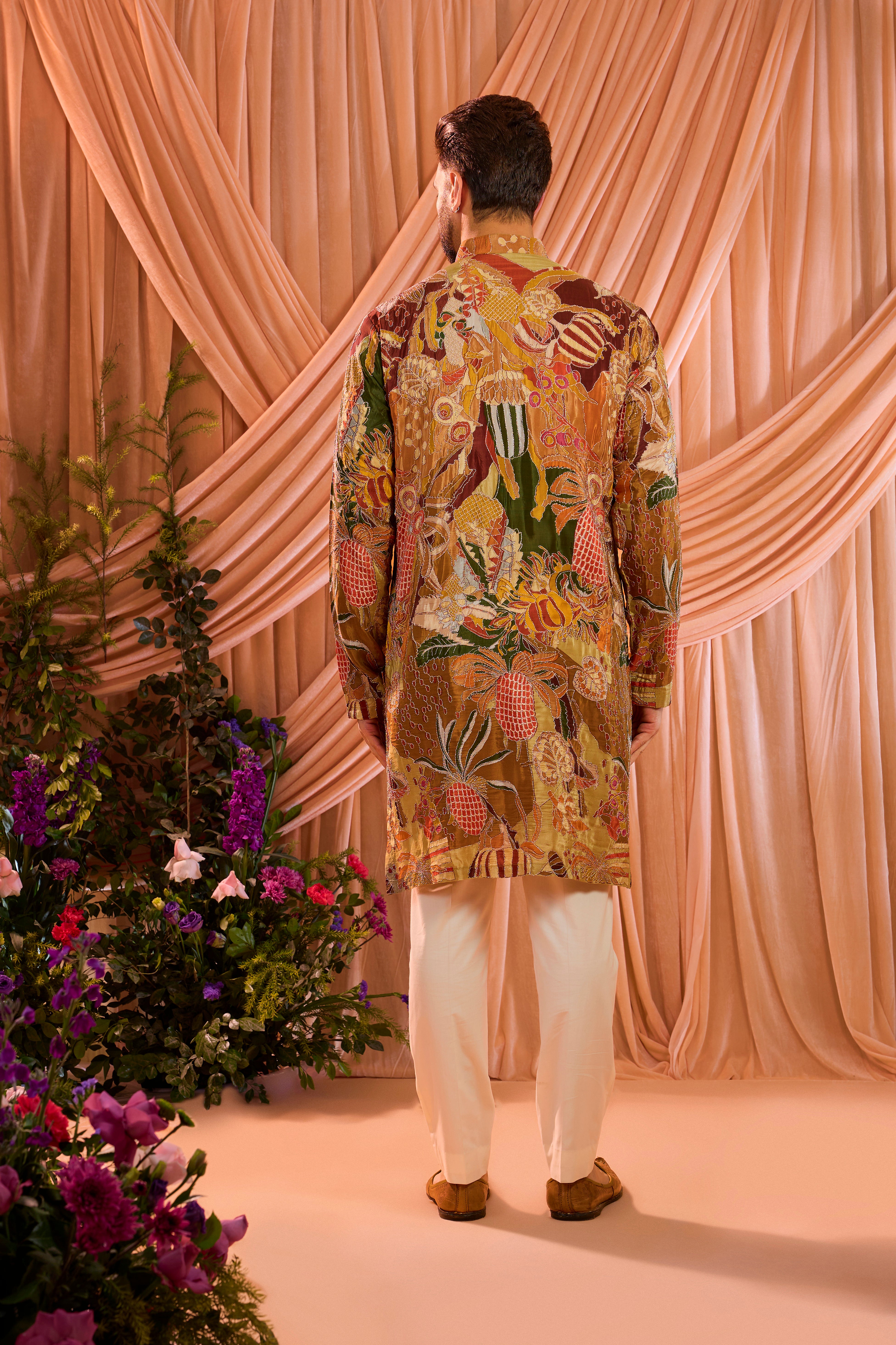 A multicoloured abstract kurta crafted on fluid crepe, elevated with meticulously detailed zari work.