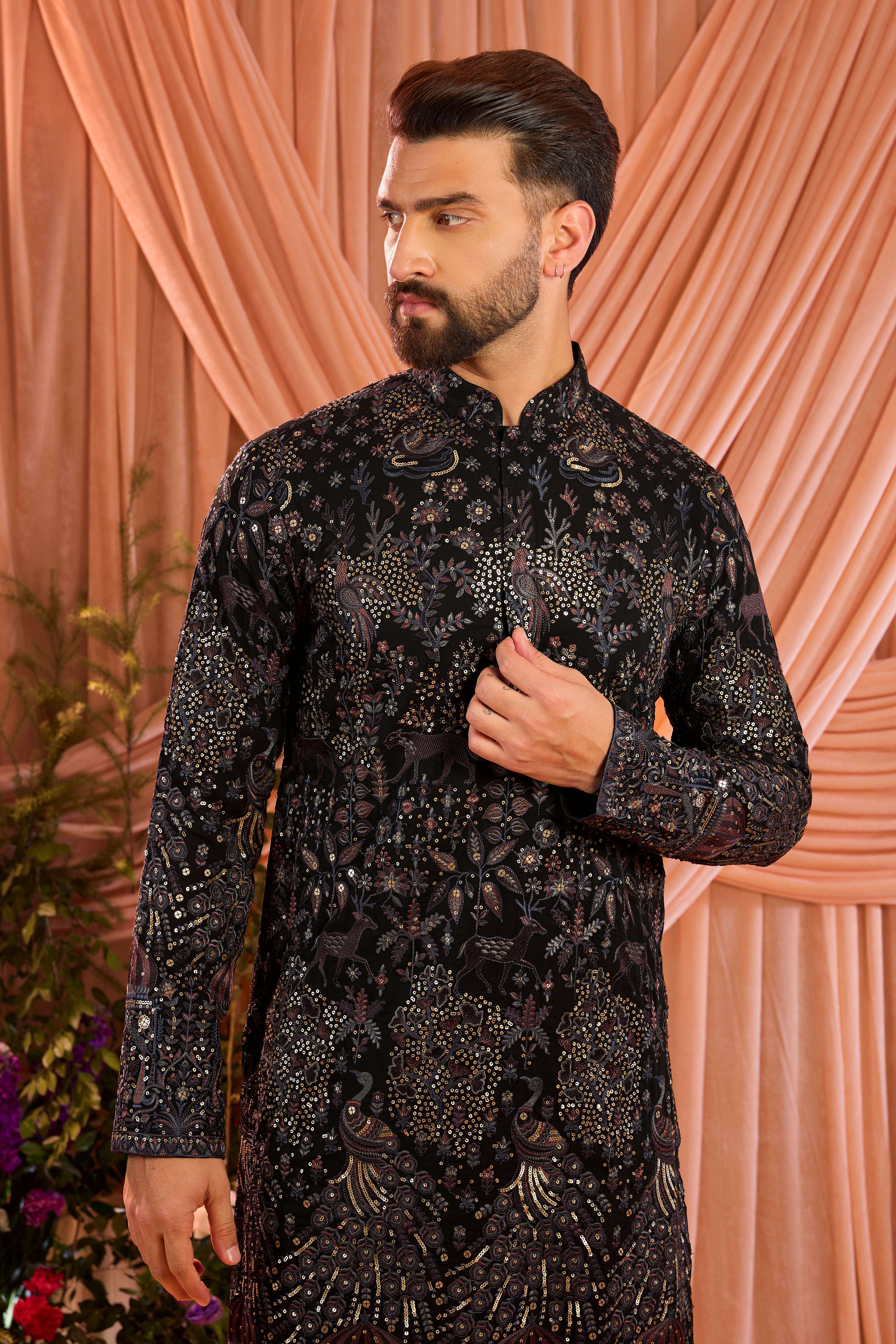 A blue/multi coloured royal heritage kurta adorned with detailed flora and fauna motifs and intricate darbar scenes.