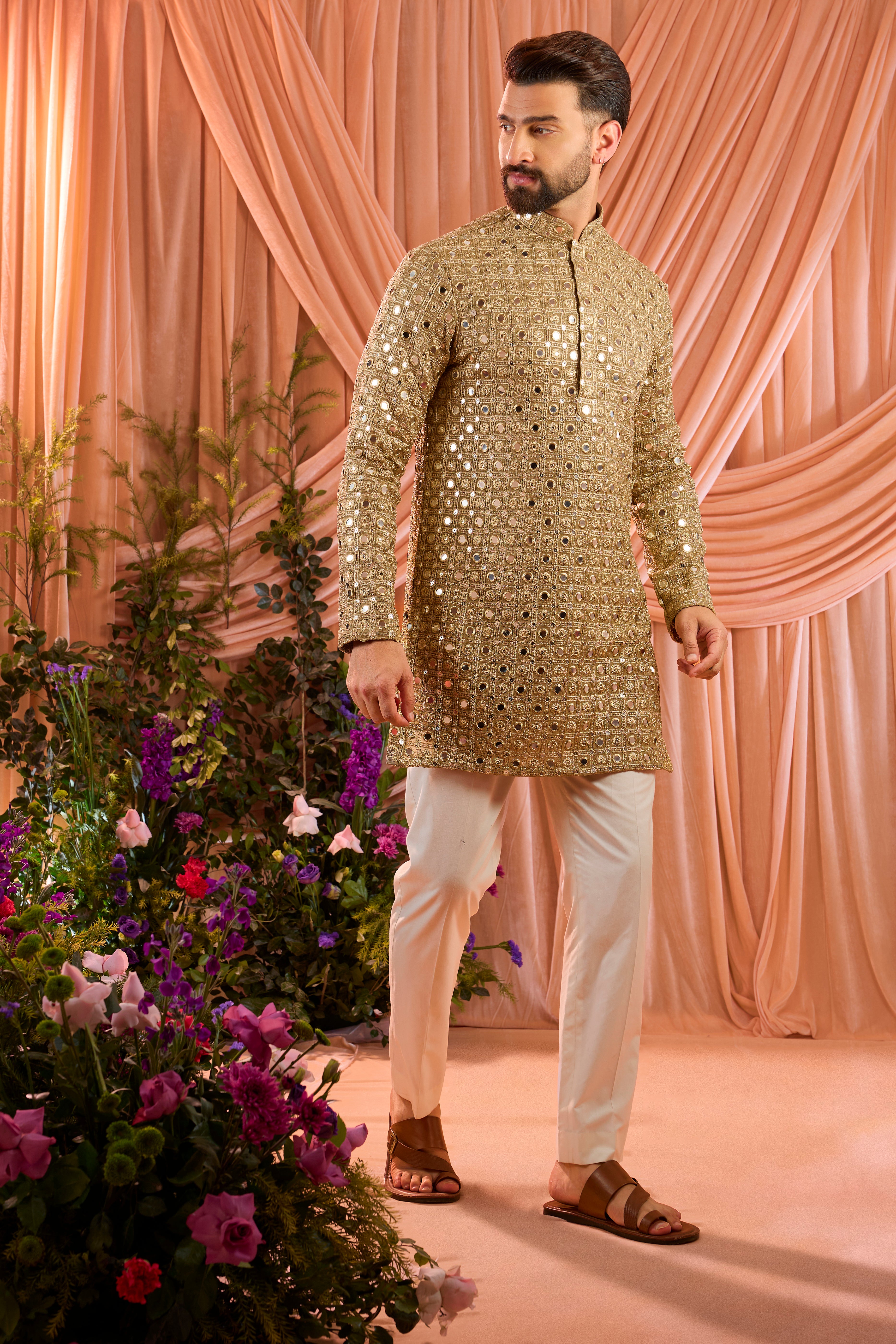 A copper short kurta featuring mirror-inspired sequin work that captures the brilliance of traditional mirror craftsmanship