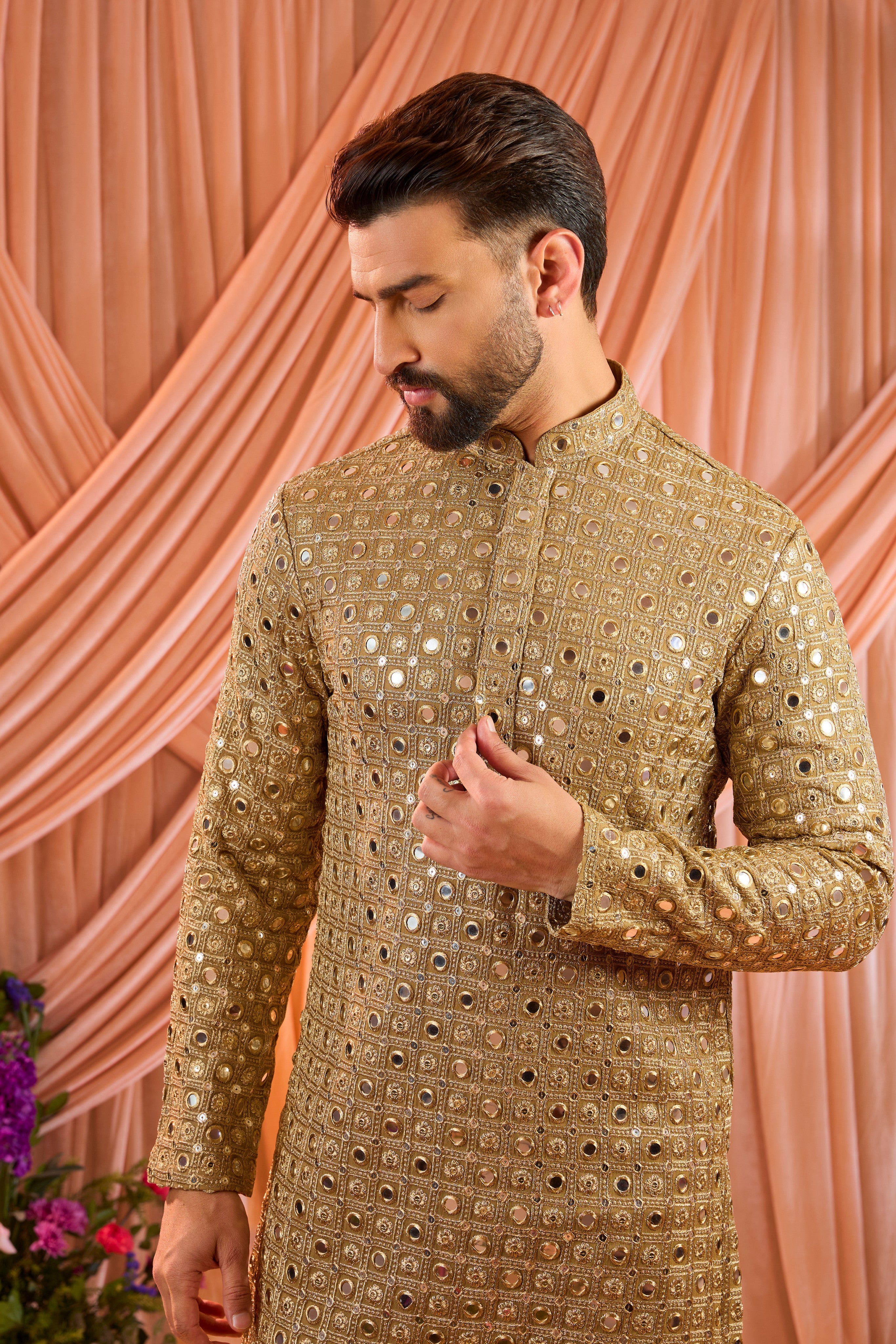 A copper short kurta featuring mirror-inspired sequin work that captures the brilliance of traditional mirror craftsmanship