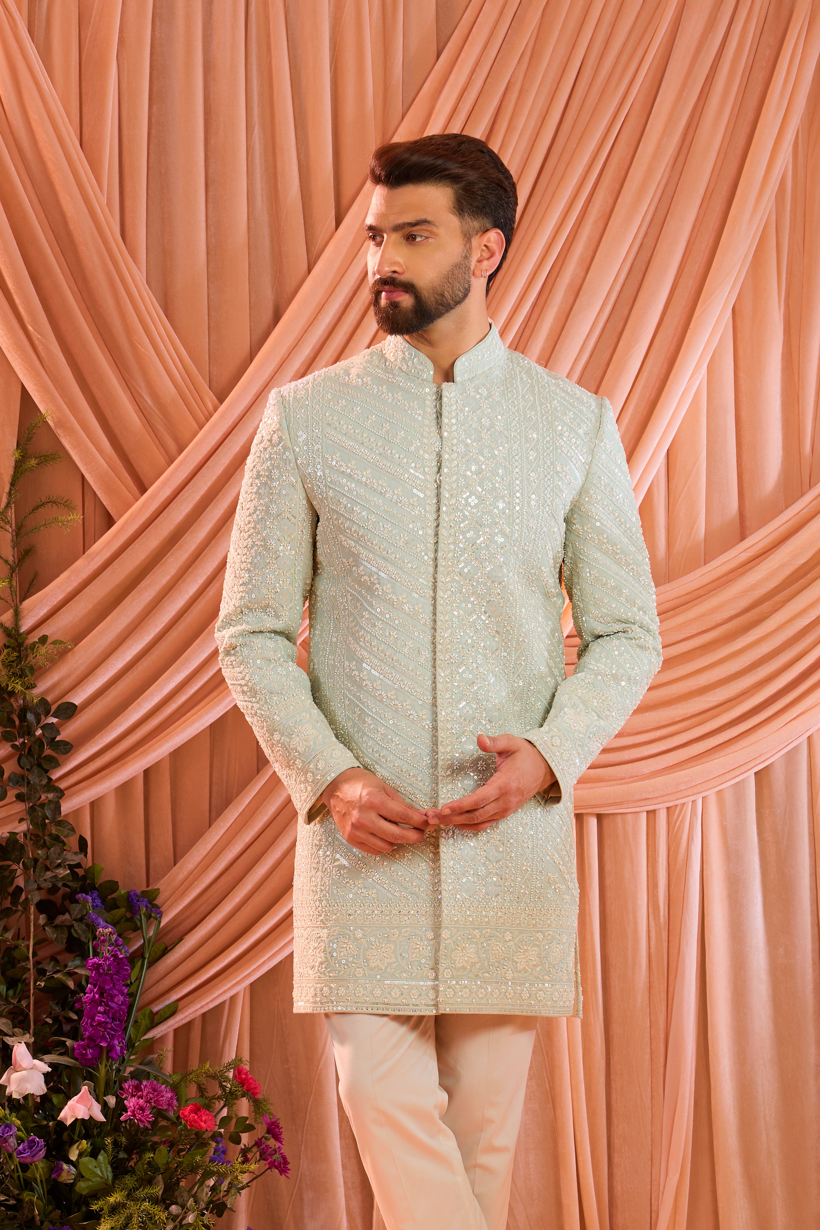 Aqua blue hand-embroidered formal sherwani, exquisitely adorned with intricate ivory cut-dana detailing.