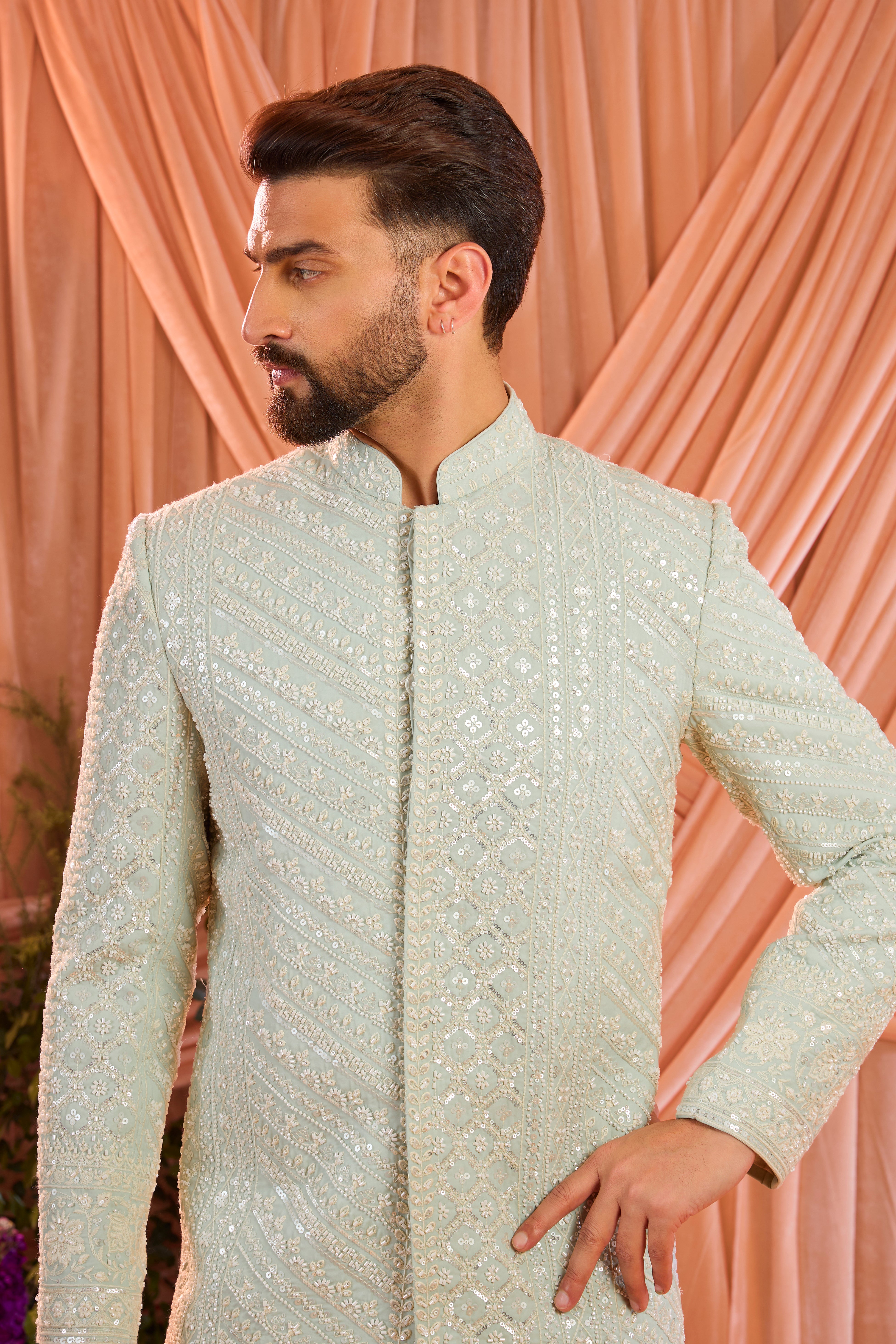 Aqua blue hand-embroidered formal sherwani, exquisitely adorned with intricate ivory cut-dana detailing.