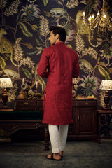 Maroon Chikankari Kurta with detailed figure embroidery.