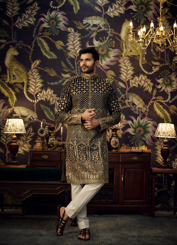 Black embroidered kurta with intricate antique golden threadwork.