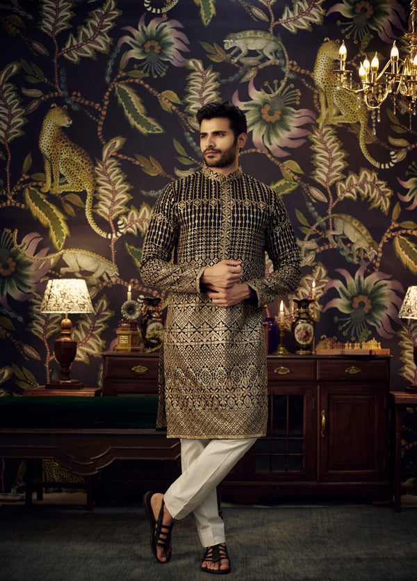 Black embroidered kurta with intricate antique golden threadwork.