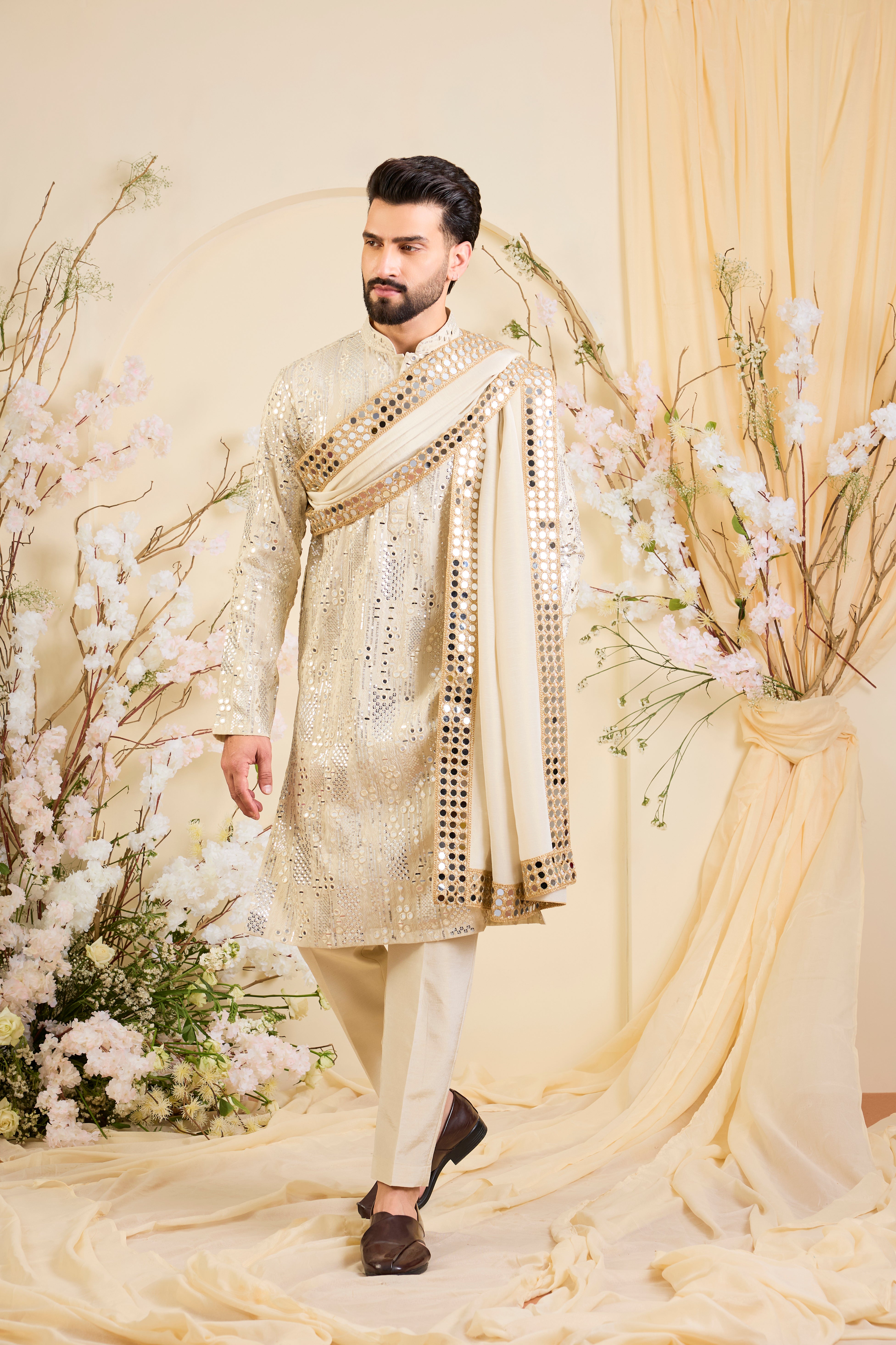Golden tissue kurta with sequin mirrorwork, paired with a real mirror work stole and striking gold border — made to shine.