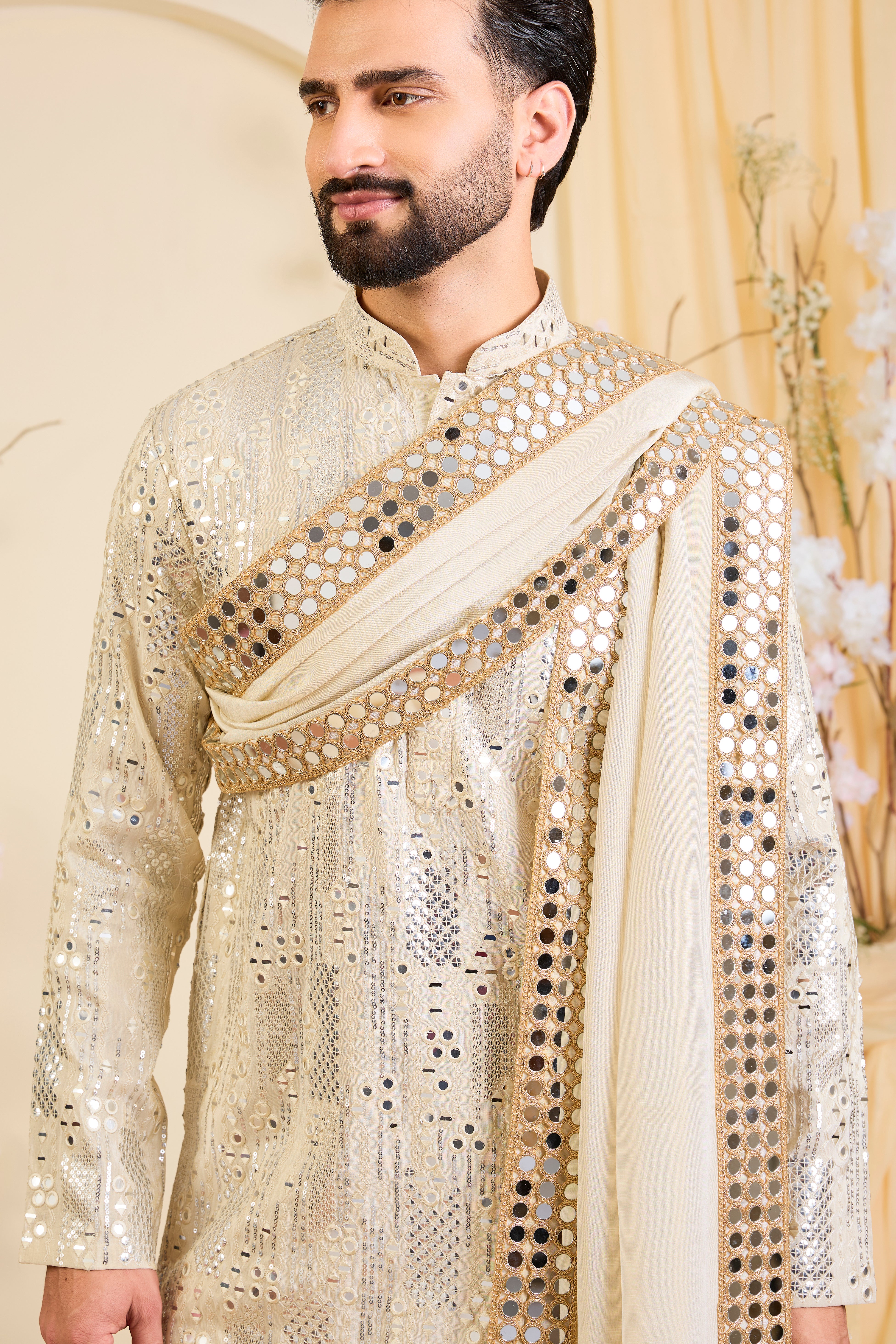 Golden tissue kurta with sequin mirrorwork, paired with a real mirror work stole and striking gold border — made to shine.
