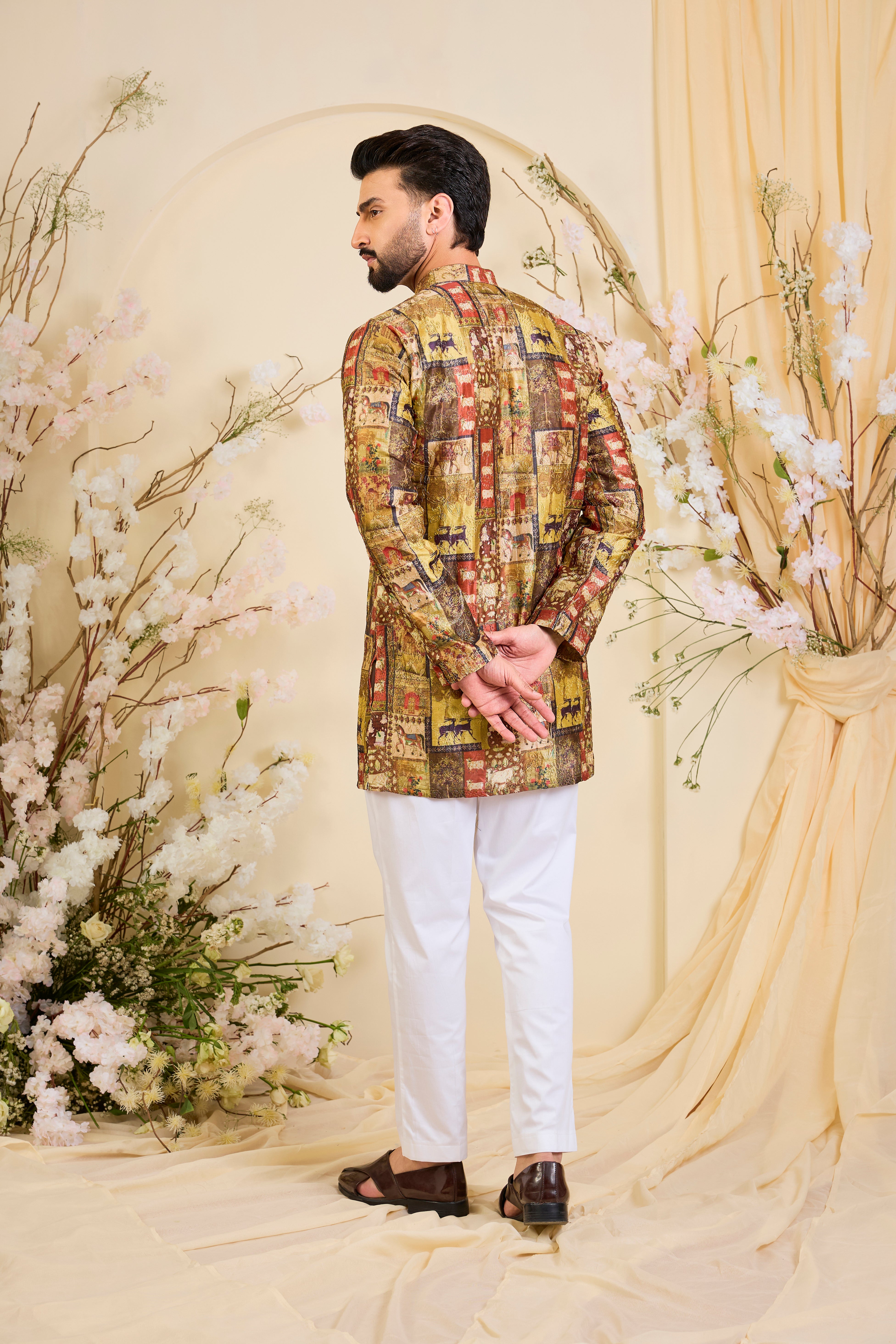 Multicoloured kurta with intricately detailed animal prints, elevated by fine zari embroidery. A bold expression of storytelling through craft.