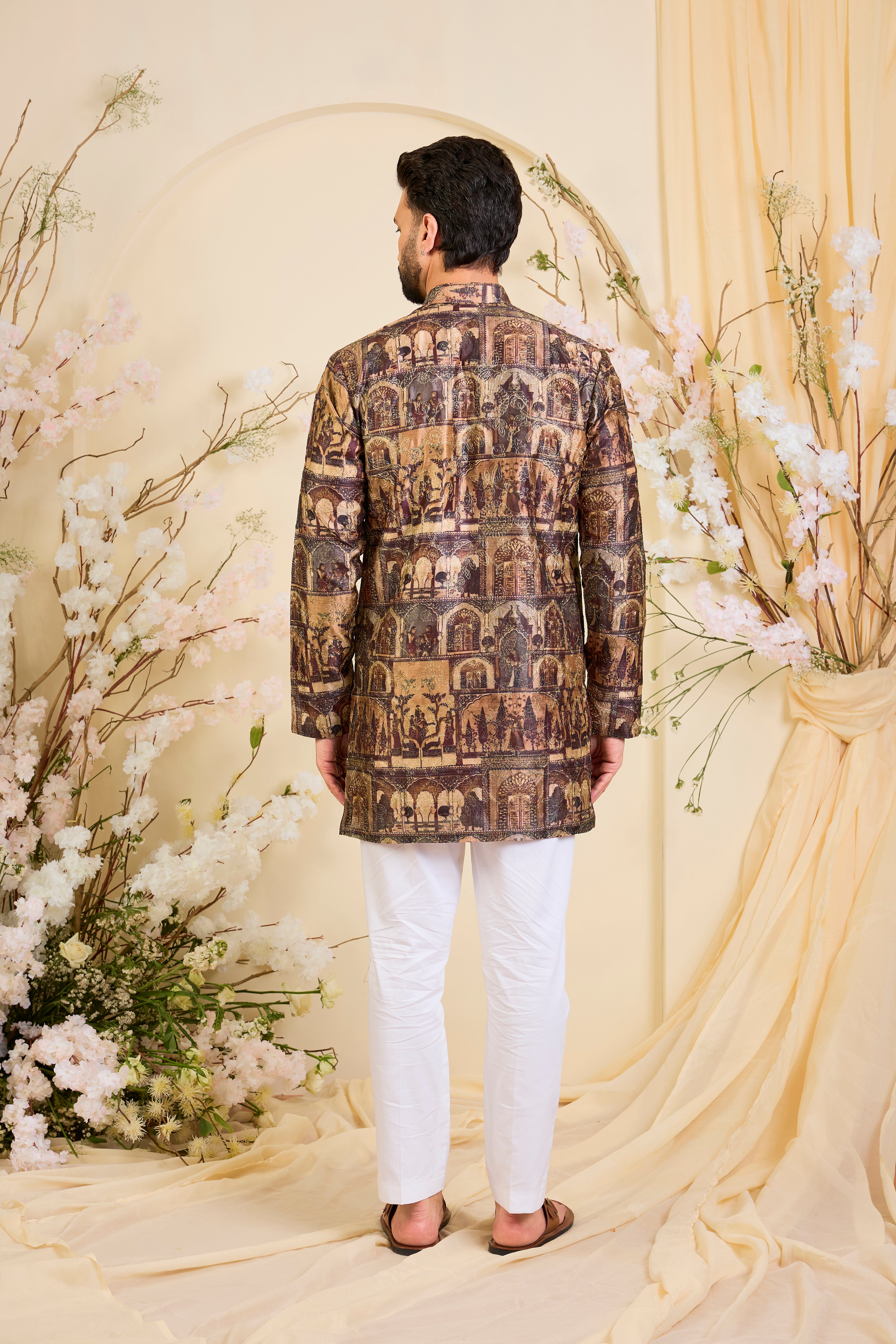 Brown kurta featuring detailed Mughal darbar scenes, enriched with intricate prints and fine aari embroidery. A tribute to royal heritage.