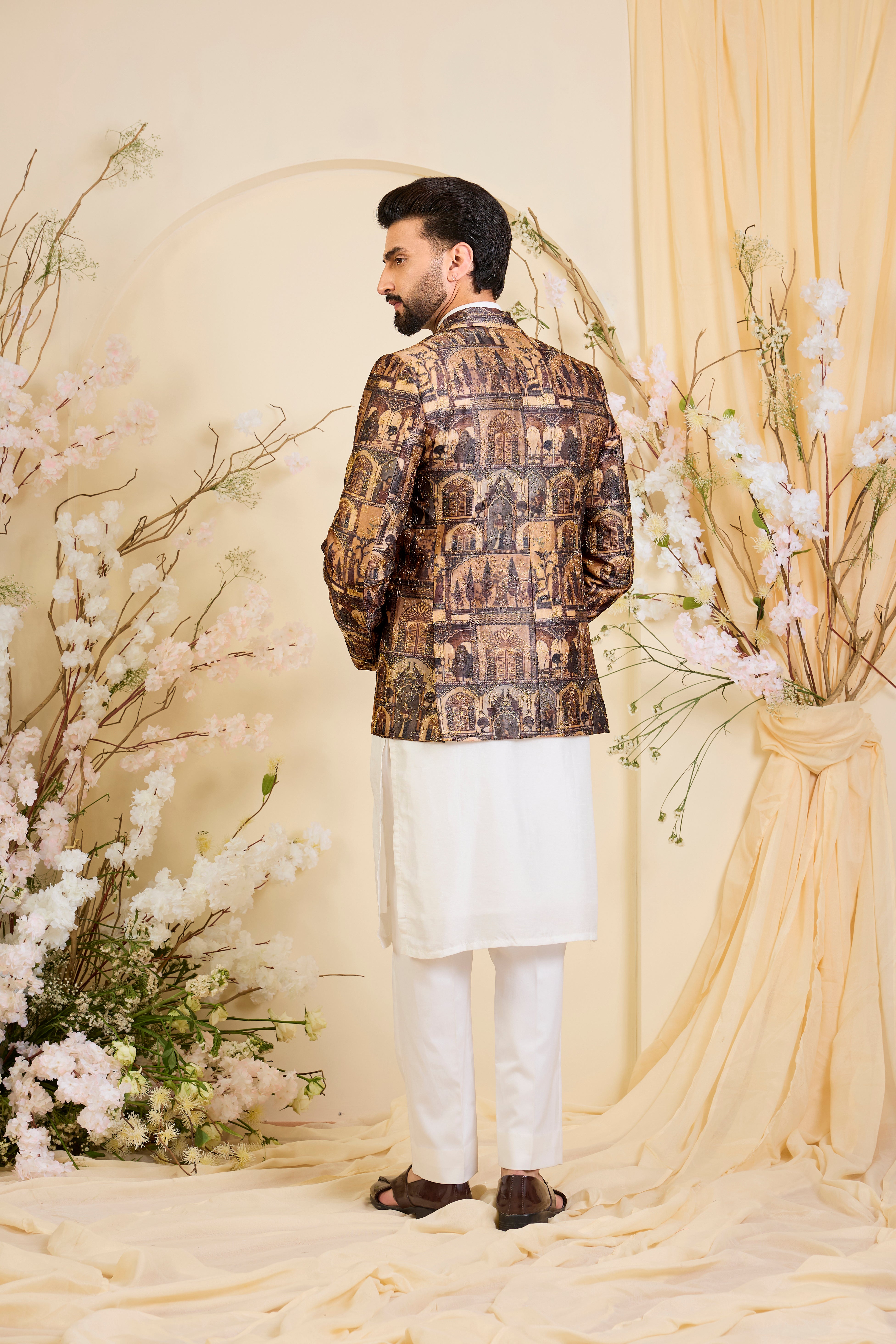 Brown blazer featuring detailed Mughal figures and courtly scenes, elevated with fine aari embroidery for a refined, heritage-rich expression.