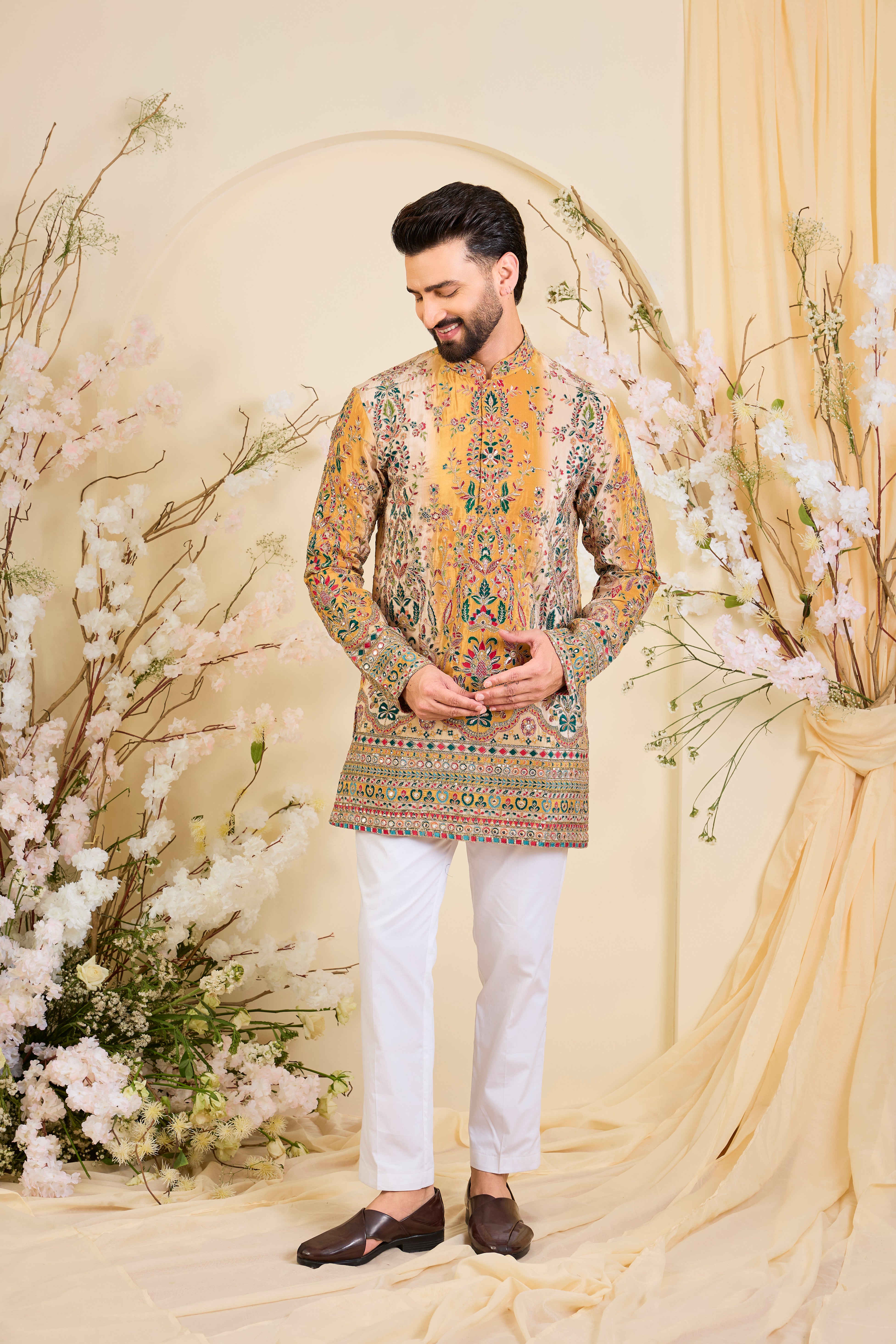 Mustard crepe short kurta with intricate zari work, vibrant multicolour prints, and refined sequin detailing.