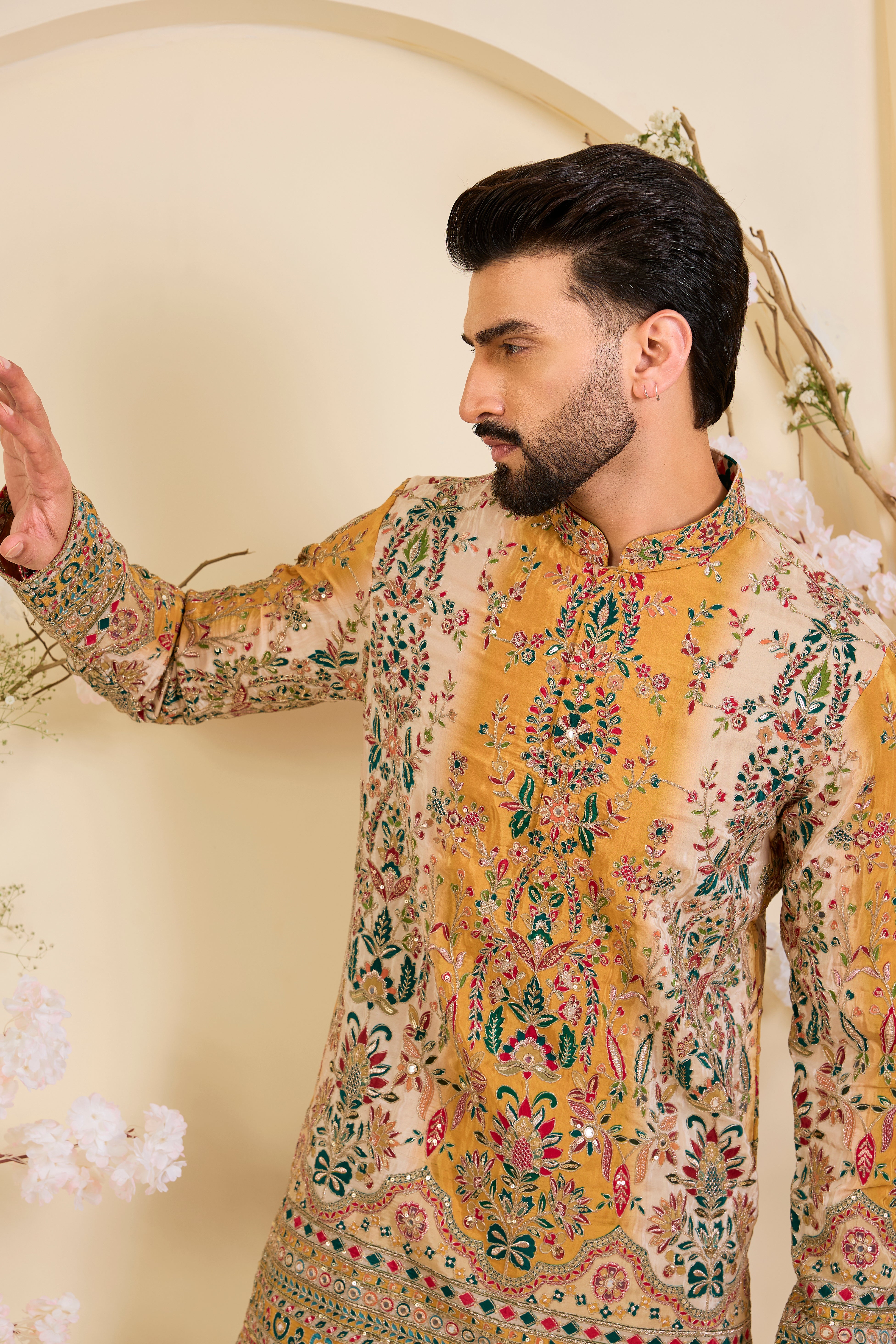Mustard crepe short kurta with intricate zari work, vibrant multicolour prints, and refined sequin detailing.