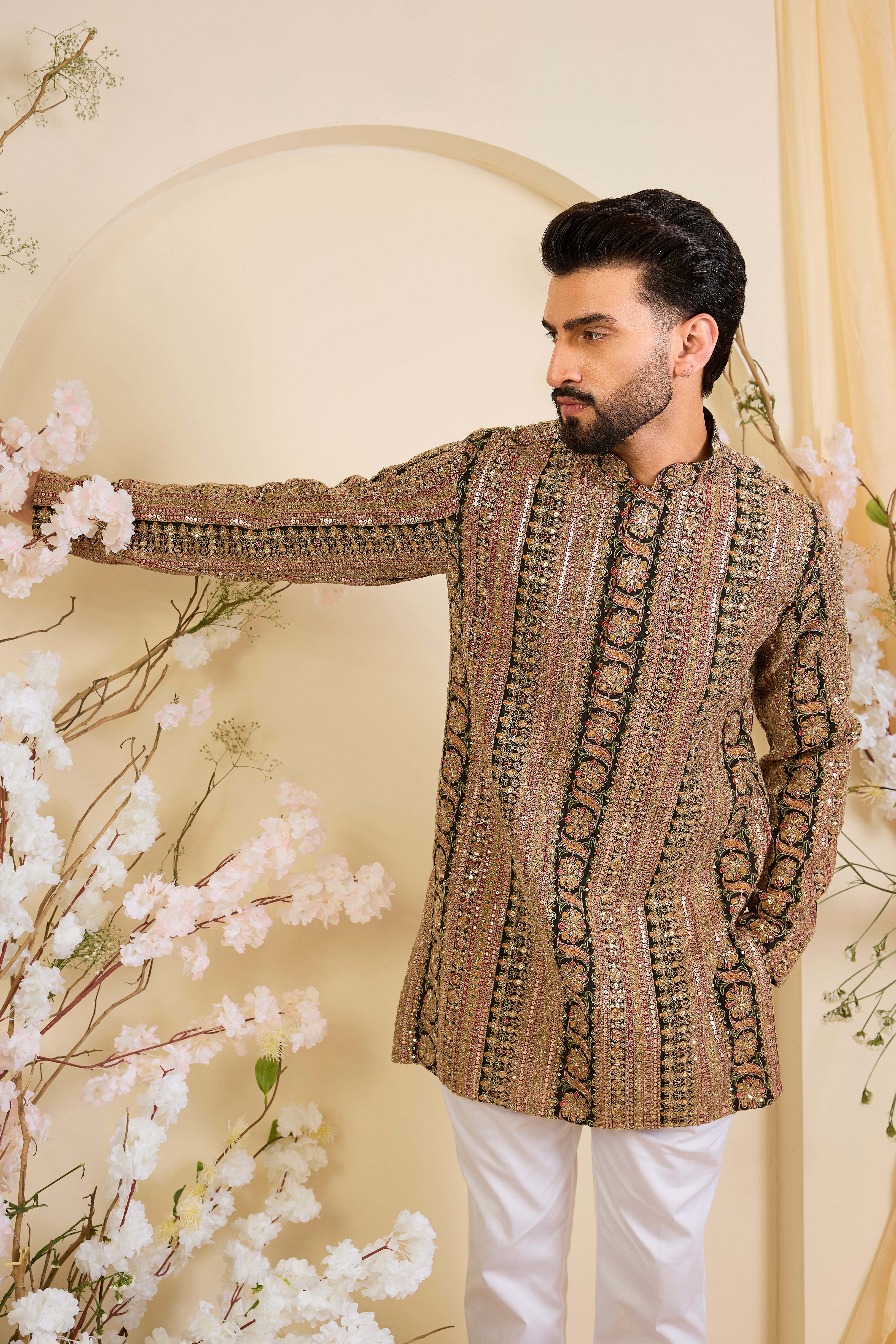 Multicoloured short kurta with heavy zari work and intricate sequin detailing, offering a bold yet refined expression of timeless elegance.