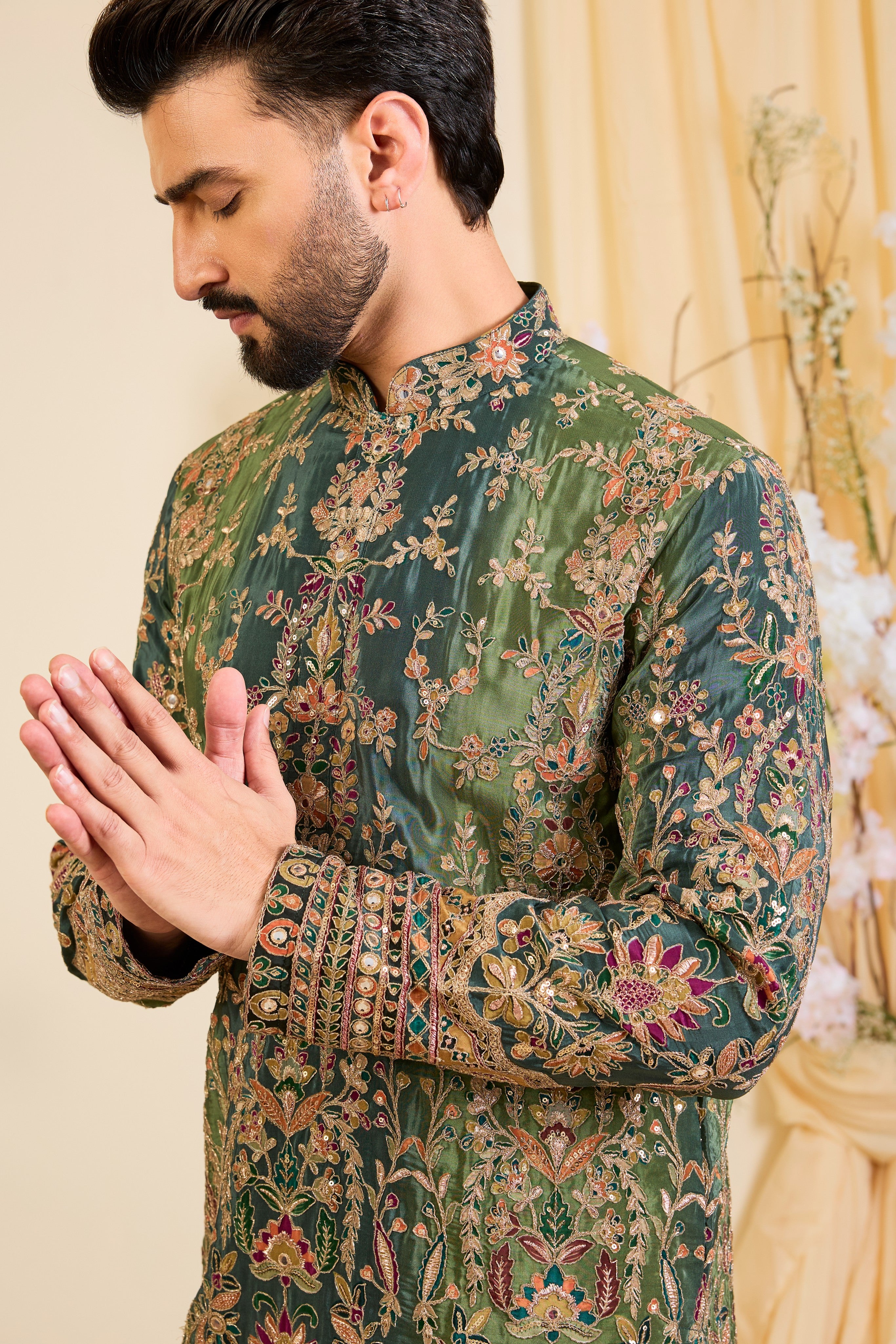 Green crepe  kurta with intricate zari work, vibrant multicolour prints, and refined sequin detailing.